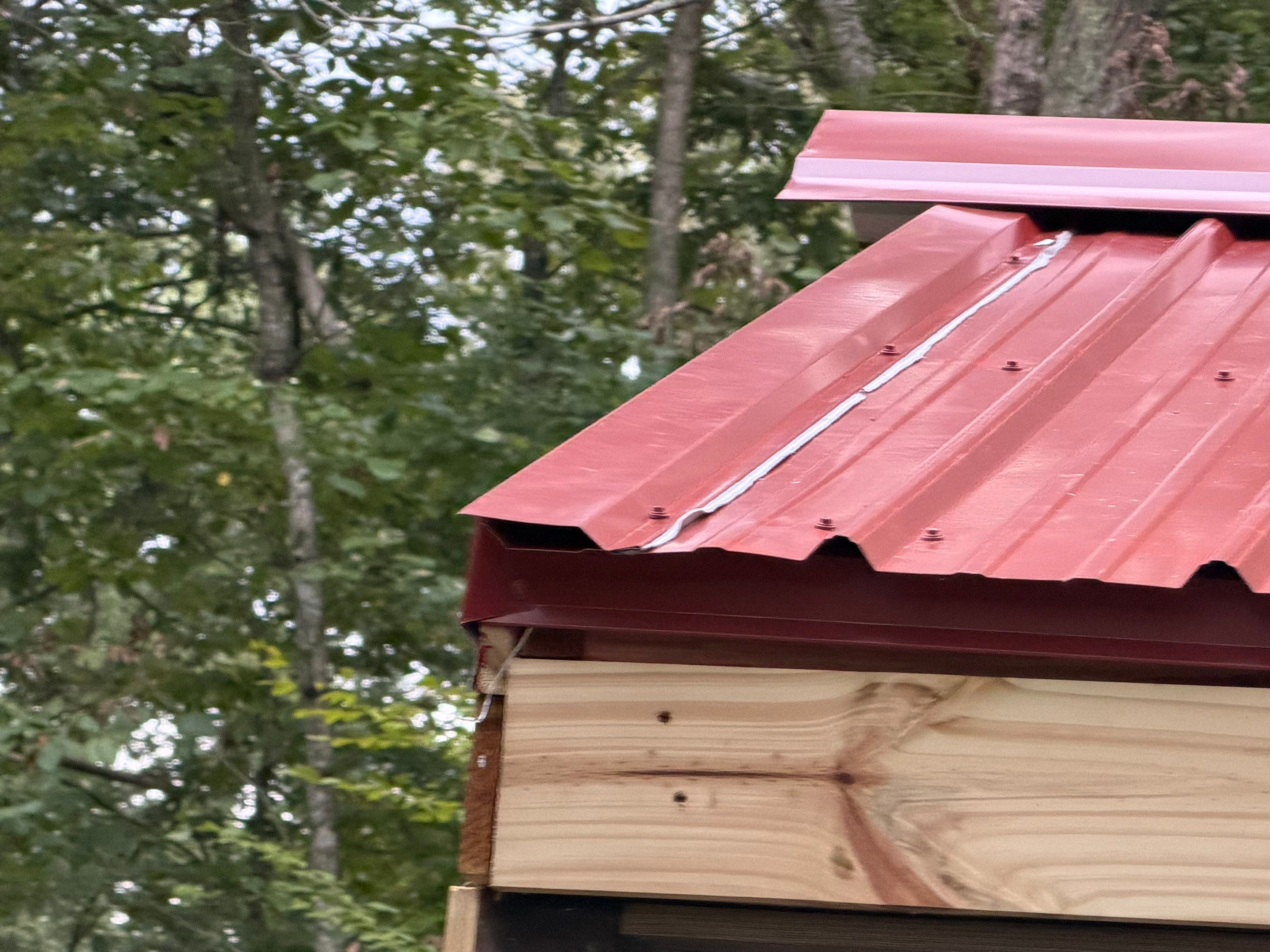 Red Metal Roof Restoration and Wood Fascia Replacement in Barboursville by Cade Construction
