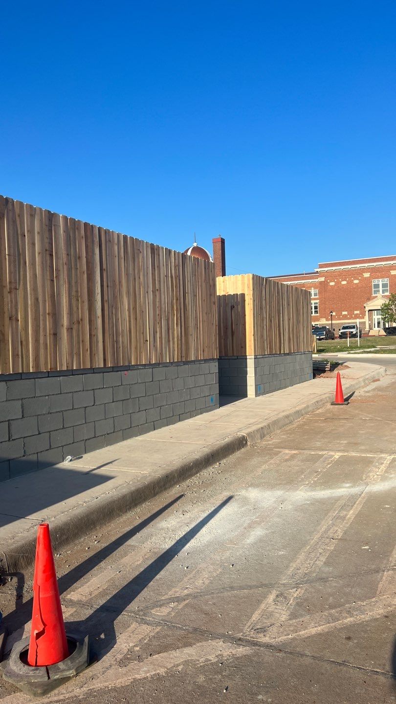 Cedar Fence using Cedar Pickets and Metal Poles by Clays Services Inc