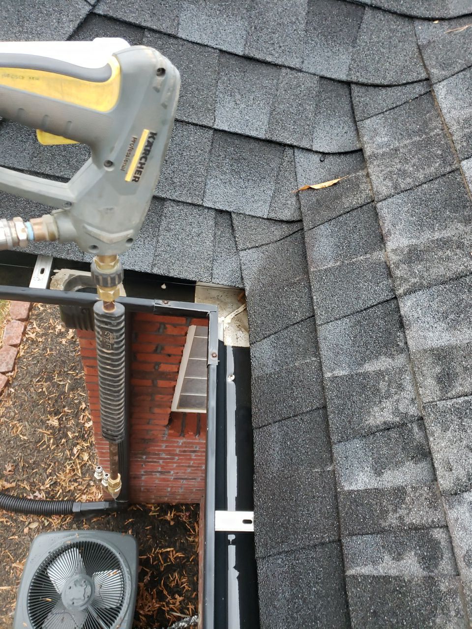 Gutter Cleaning using water by Power Wash Masters LLC