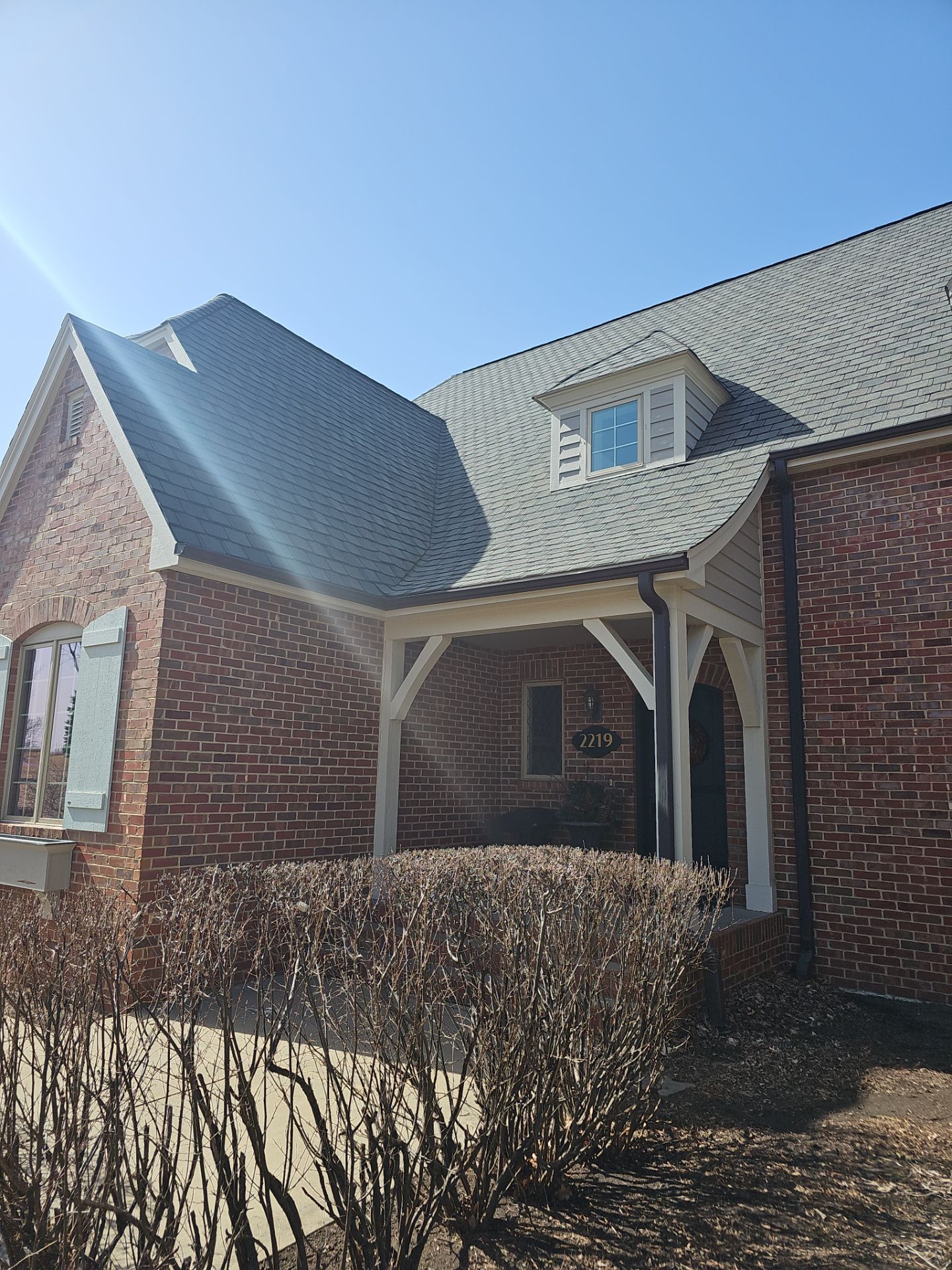 Residential Exterior Brick Painting and Limewash Refresh in Sioux Falls by Select Painting, Coatings & Garage Cabinets
