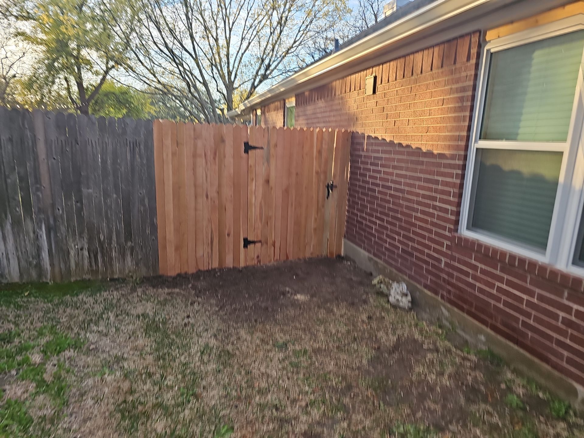 Fence Installation using Cedar Pickets by DeZign Roofing & Exteriors