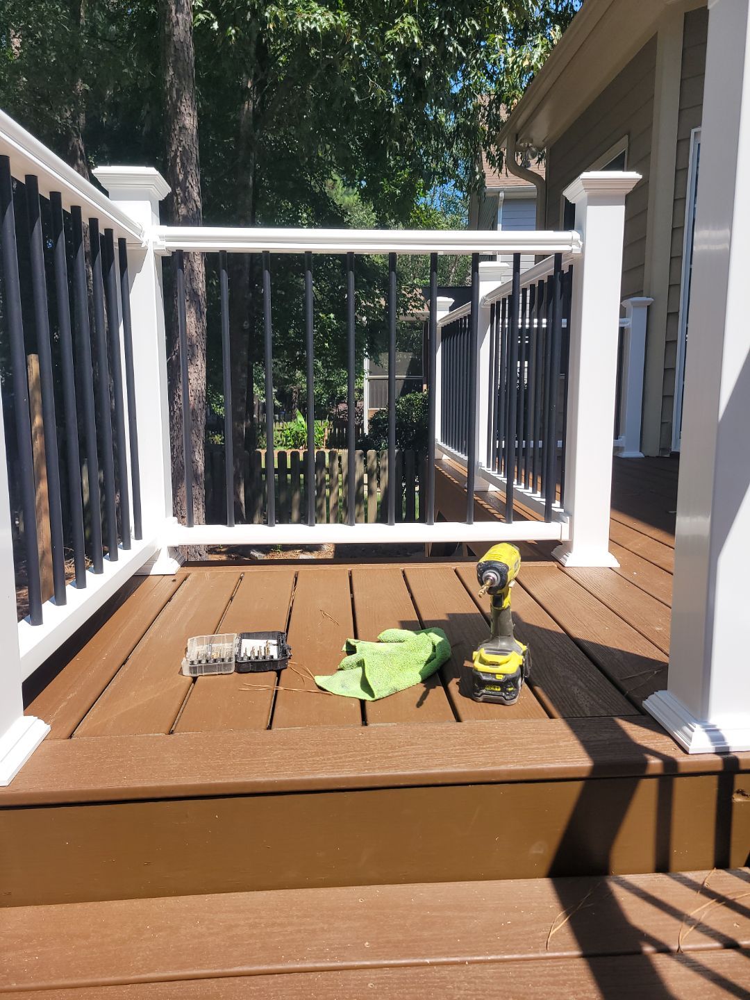 Fuquay-Varina Outdoor Upgrade – Composite Deck & Paved Landing by Elite Remodeling and Design LLC