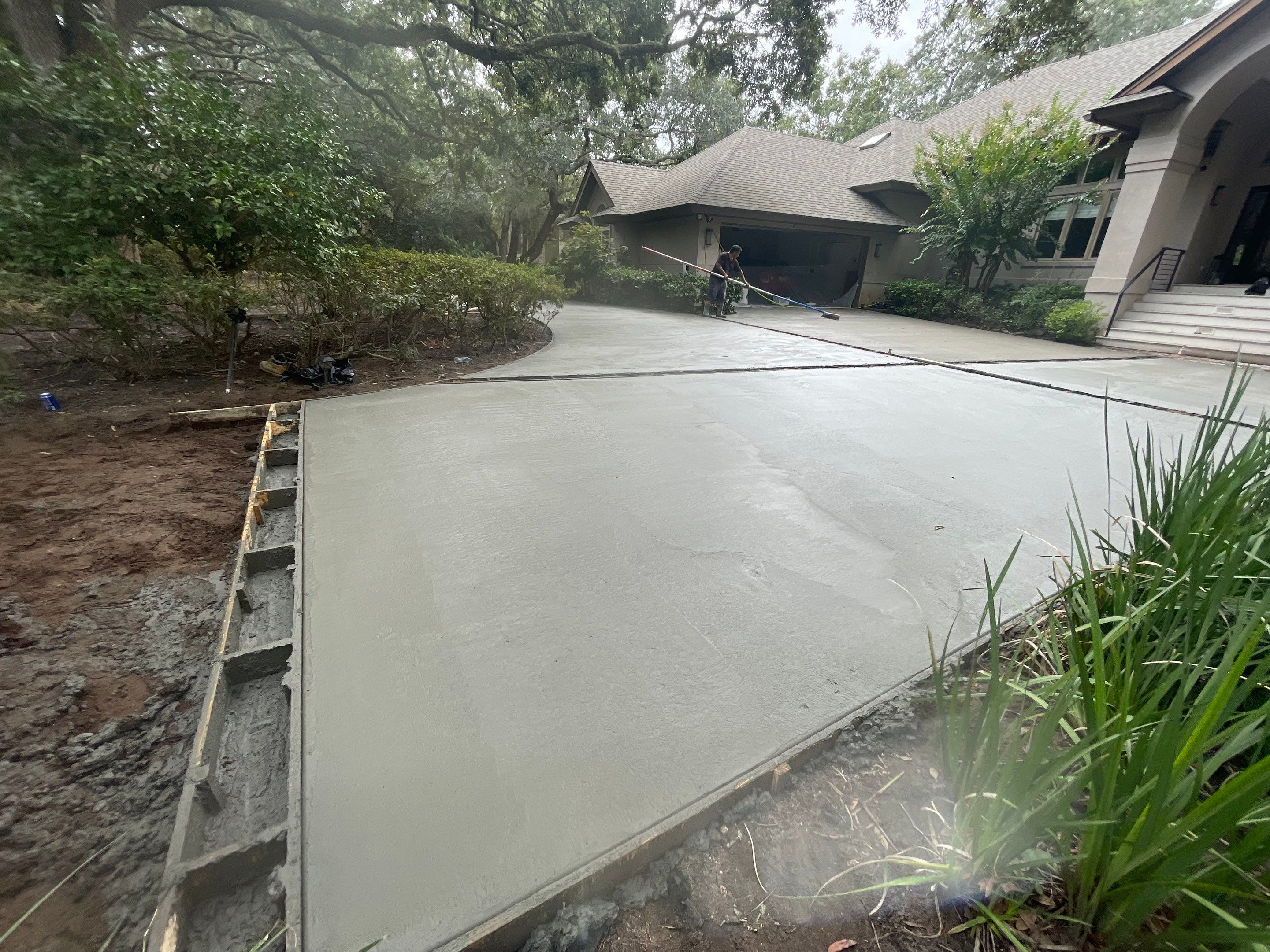 Custom Concrete Driveway with Decorative Paver Inlays in Hilton Head Island by Lowcountry Scapes, LLC