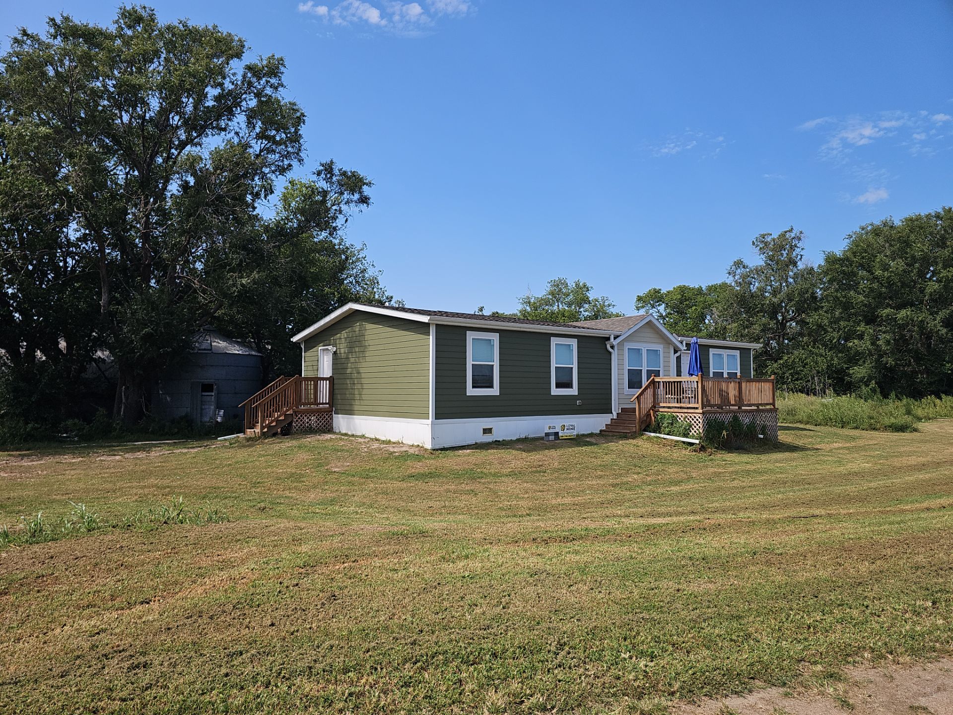 Riverdale Exterior Transformation | TAMKO Roofing & James Hardie Siding by Loyal Nine
