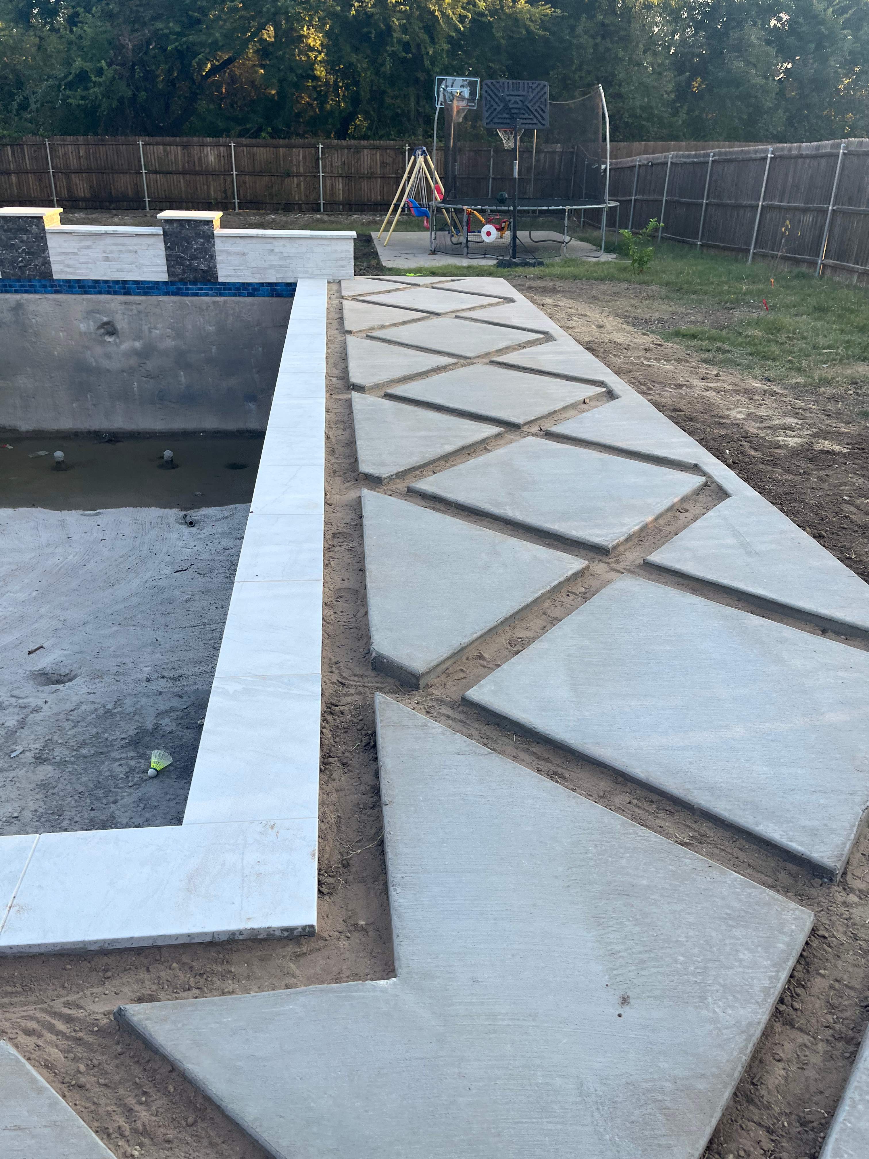 Modern Geometric Pool with Raised Wall and Paver Deck by Pinnacle Pools and Spas - DFW