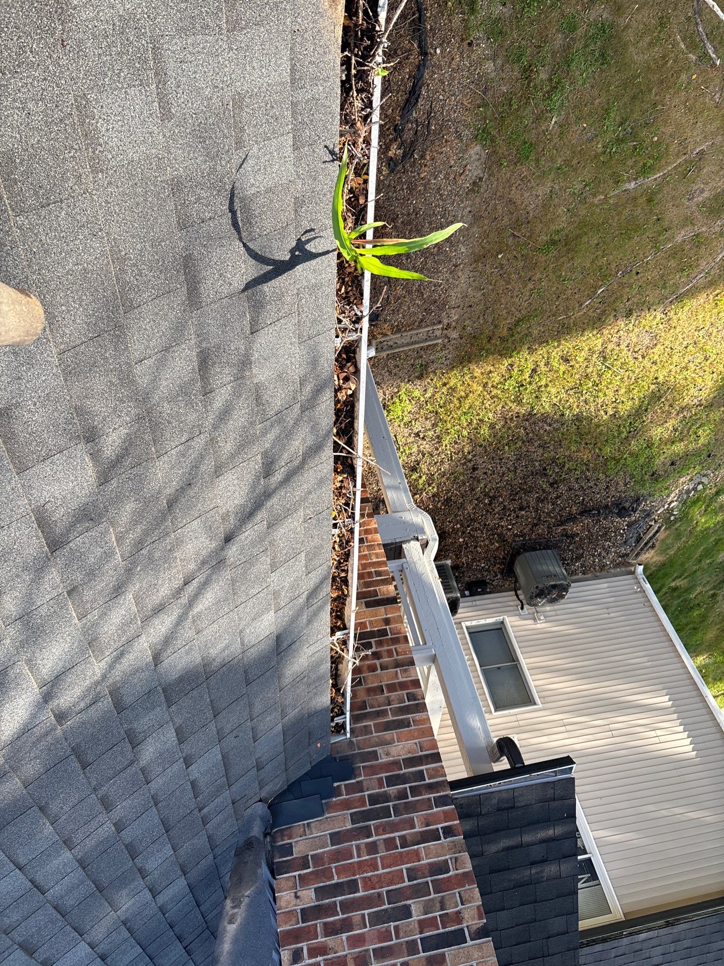 Commercial gutter cleaning Des Moines before photo with filled gutters
