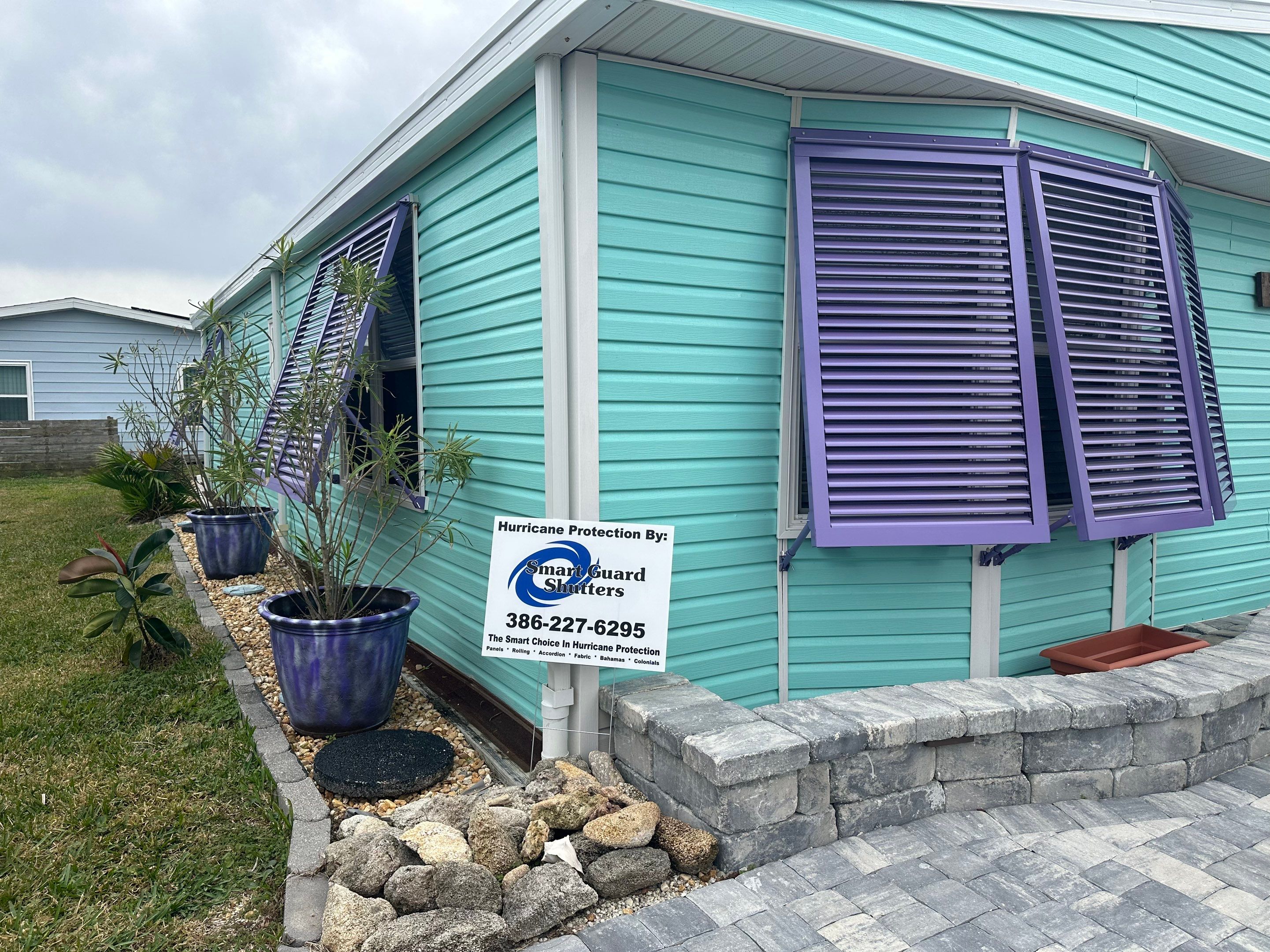 Hurricane Rated Bahama Shutters in Pearl Violet by Smart Guard Shutters