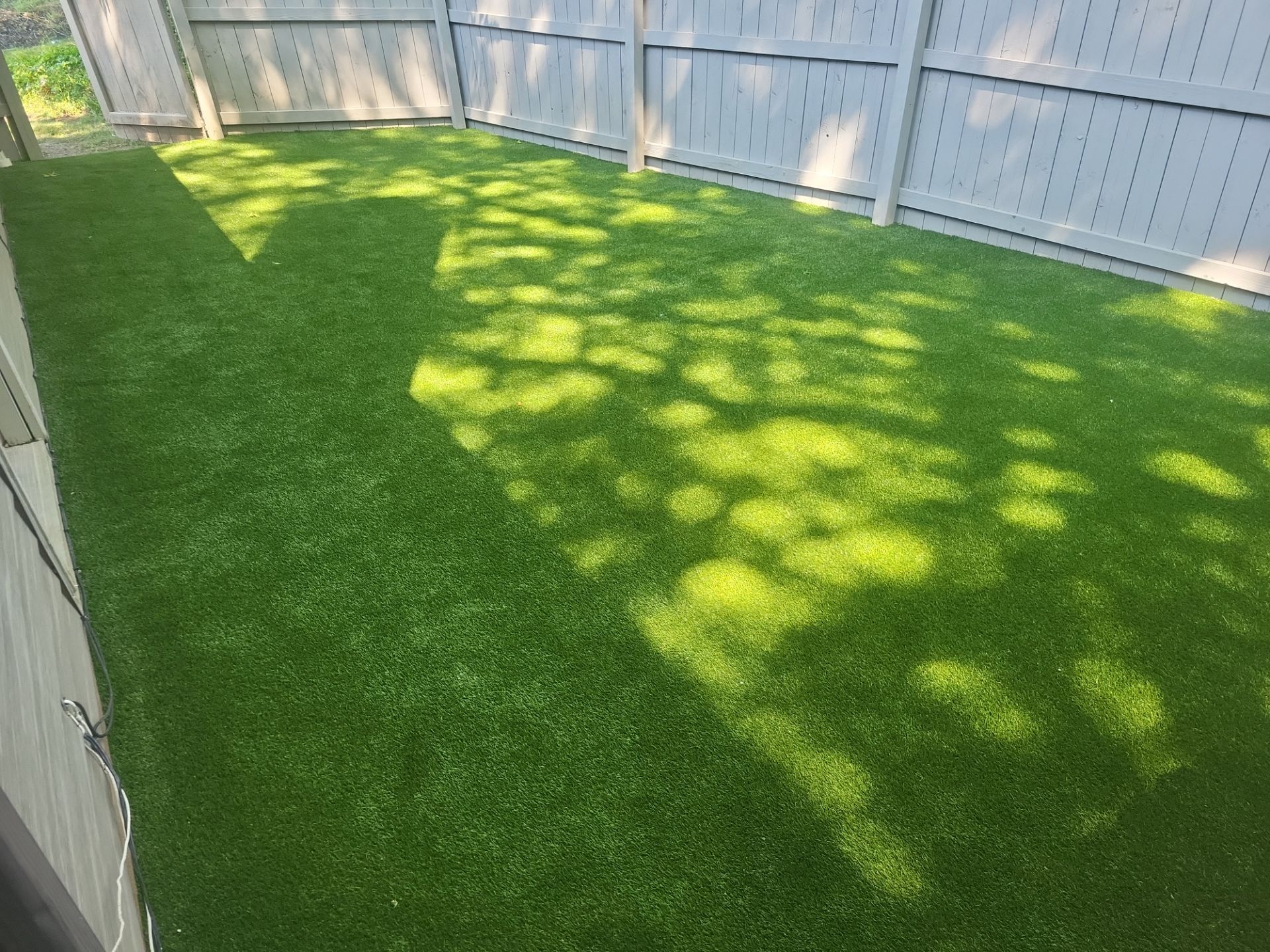 Synthetic Turf Installation for a Residential Backyard in Westlake by Southwest Greens Midwest