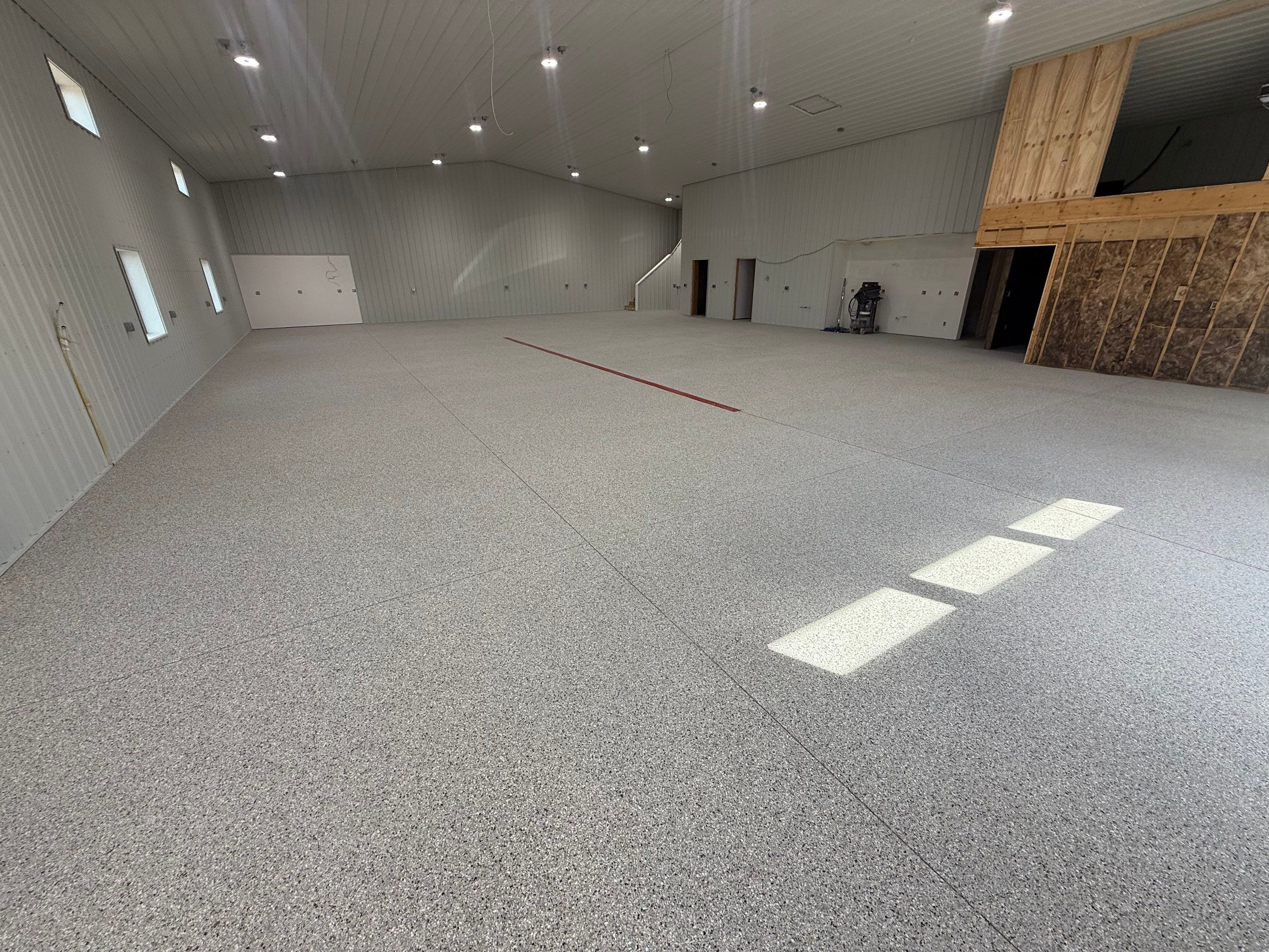 Custom Speckled Floor Coating for Large Montrose Shop by Select Painting, Coatings & Garage Cabinets
