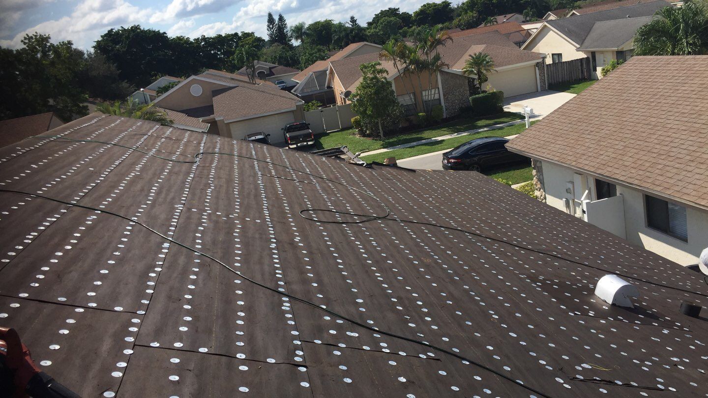 Residential Roofing Installation using 1" Nail strip metal roof by BLUES BROTHERS CONSTRUCTION CORP