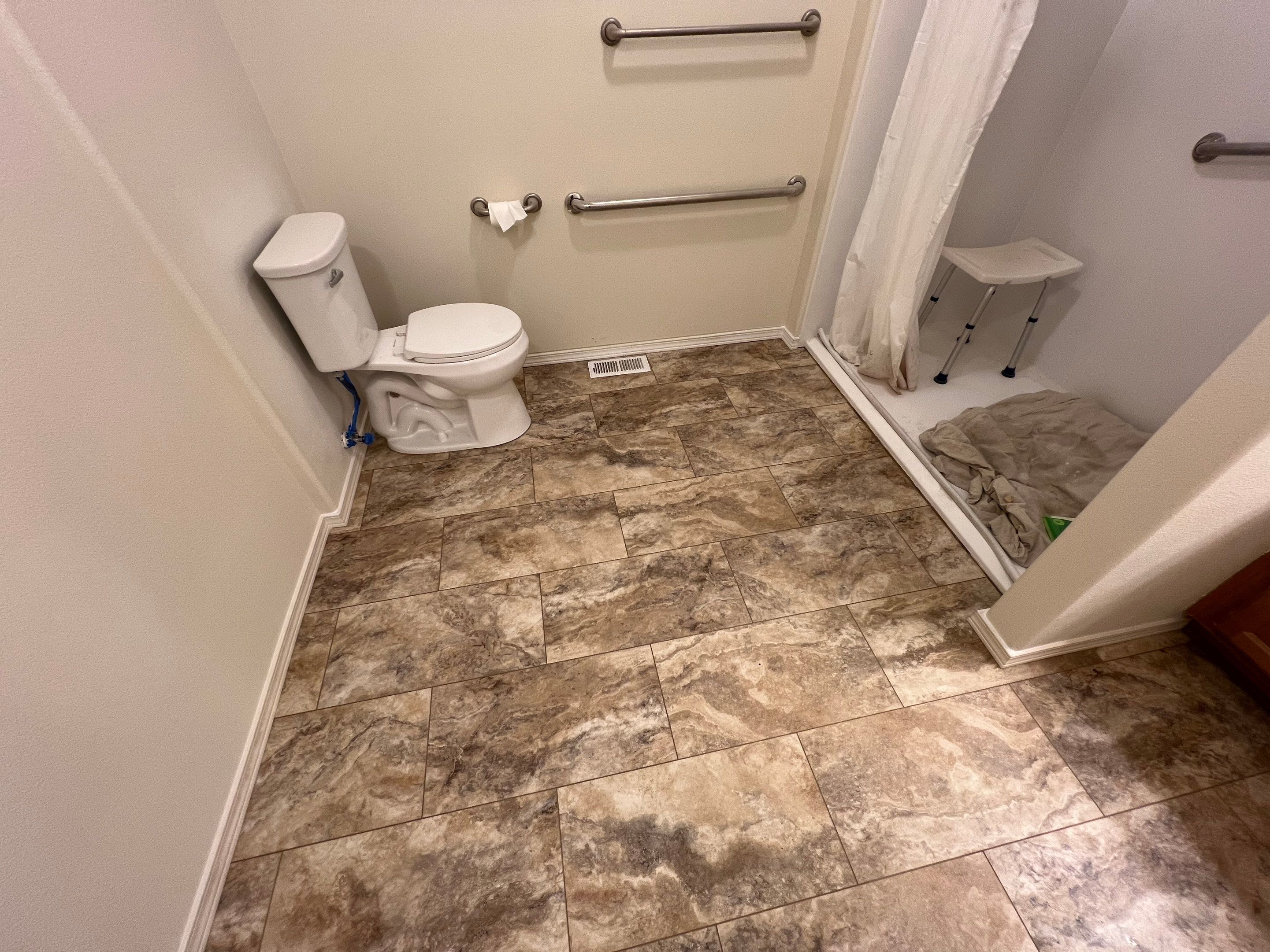 Bathroom flooring upgrade by Handyman State LLC