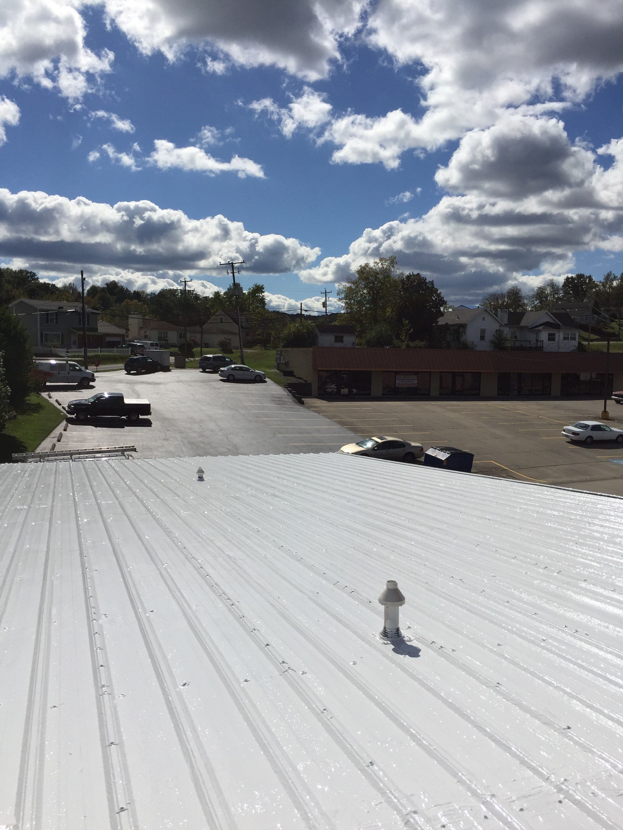 Commercial Roof Coating using Gaco Silicone Roof Coating by Secure Construction Company Inc