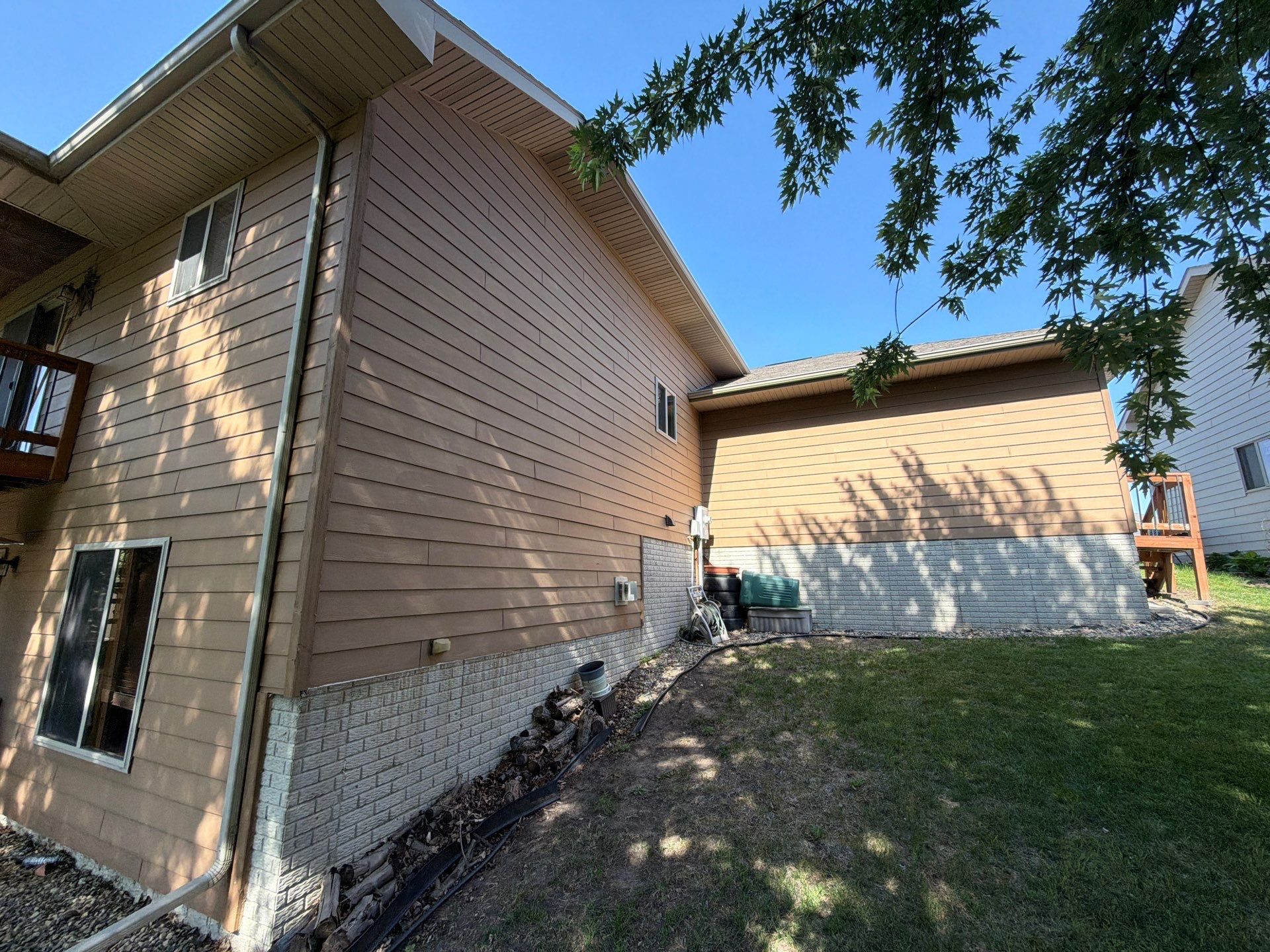 Full Exterior Residential Painting and Siding Refresh in Tea by Select Painting, Coatings & Garage Cabinets