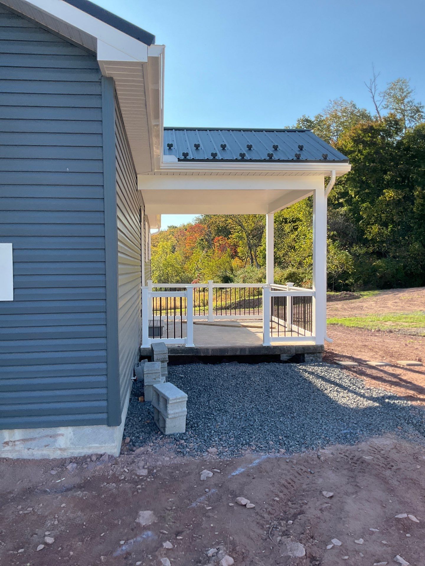 New Residential Addition with Blue Siding and Metal Roofing in Ashland by Esh Builders
