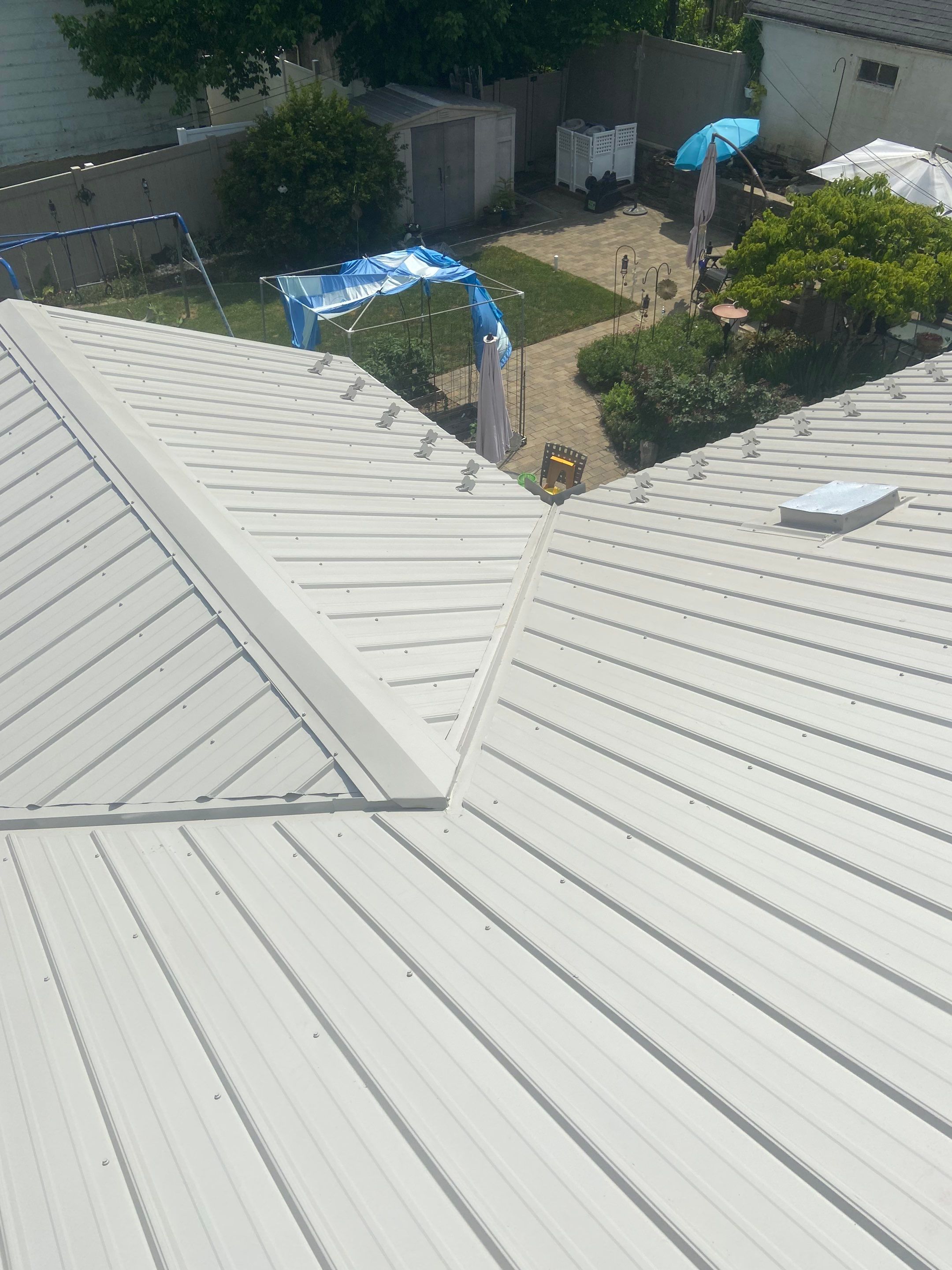 Metal Roofing, Skylights, Porch Build by Secure Construction Company Inc