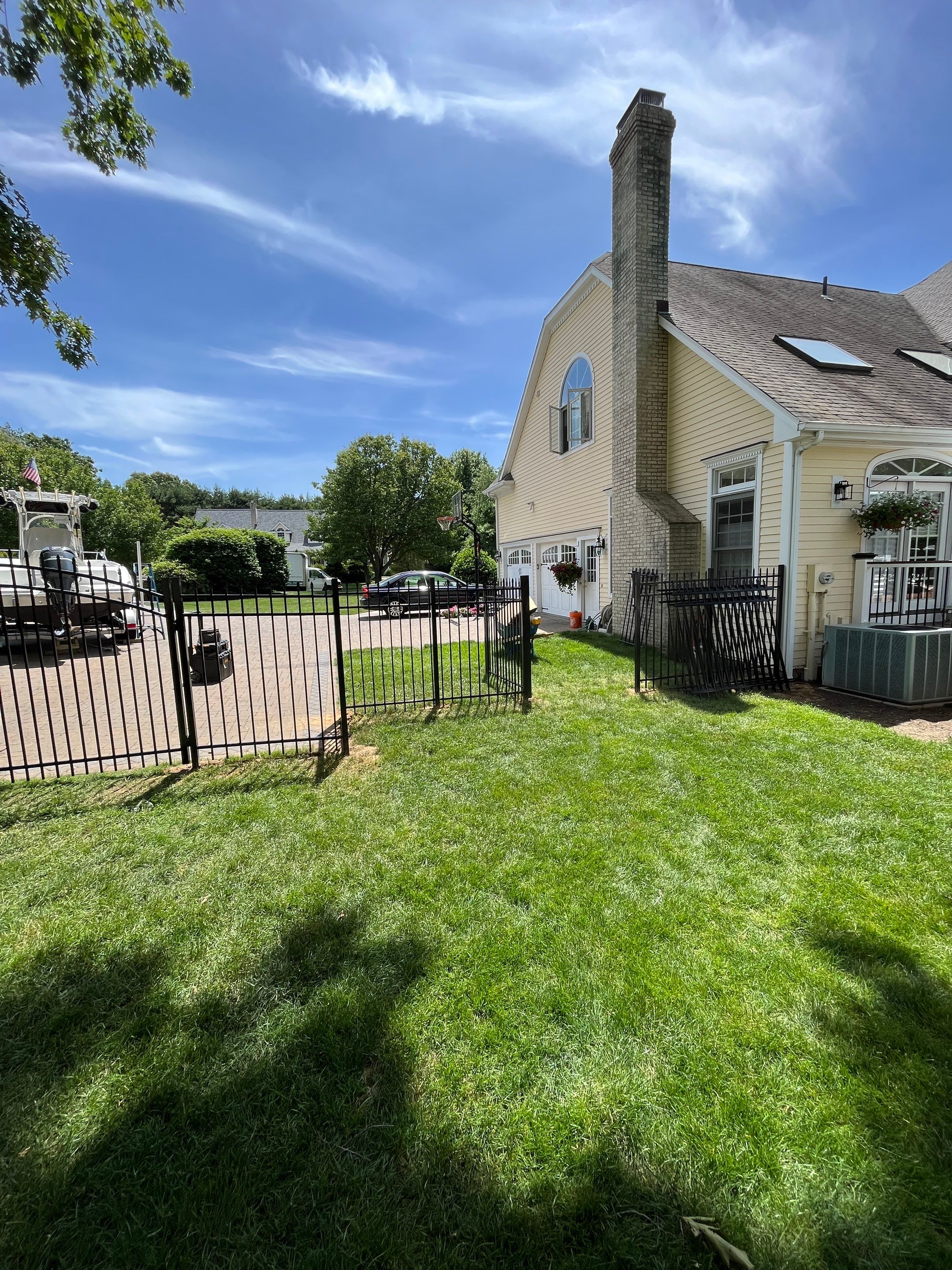 New Black Aluminum fence with matching gate by DiGiorgi Roofing and Siding Inc
