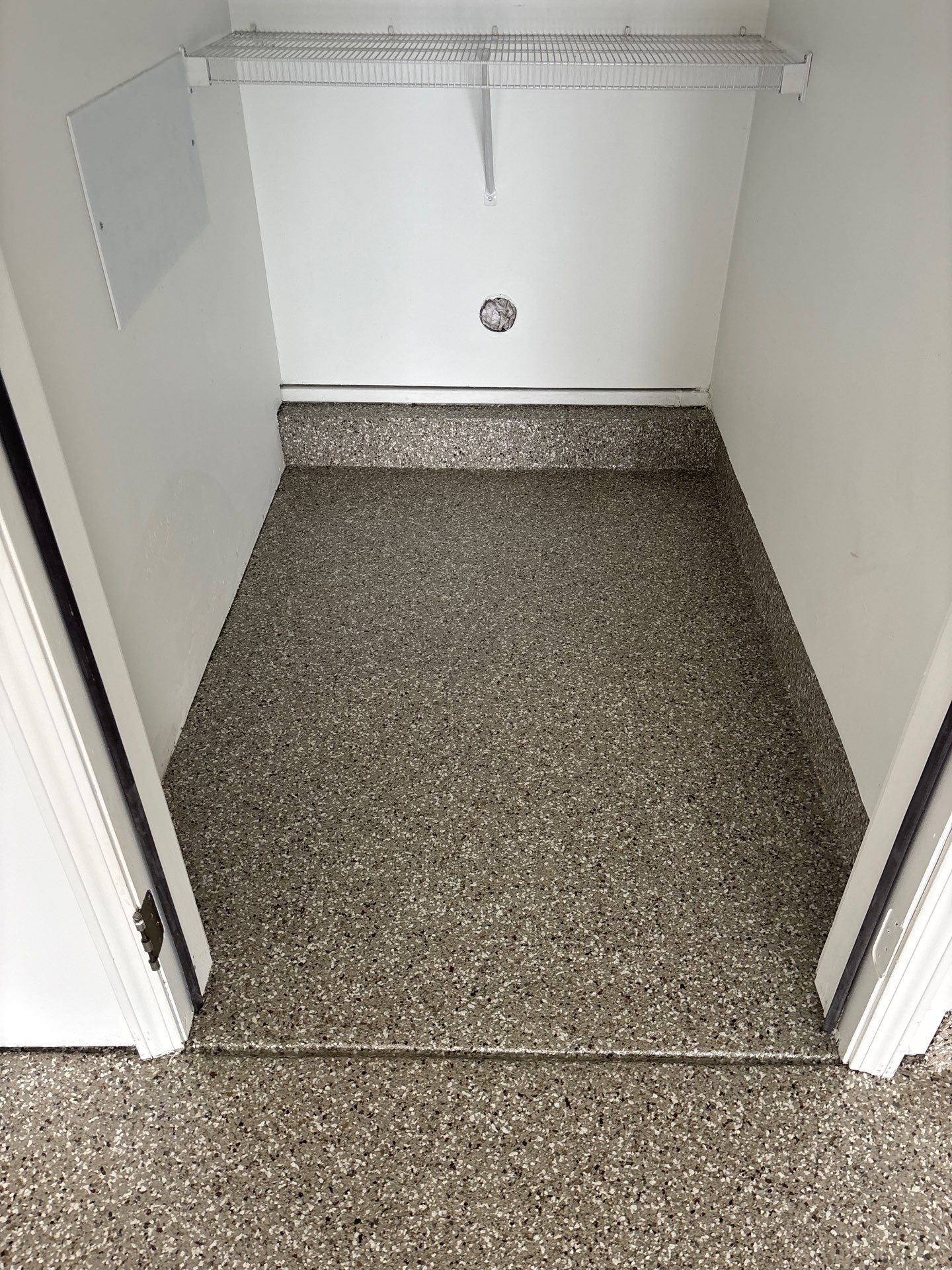 Garage floor in Holt using Smoke Flake by Freedom Concrete Coatings. 
