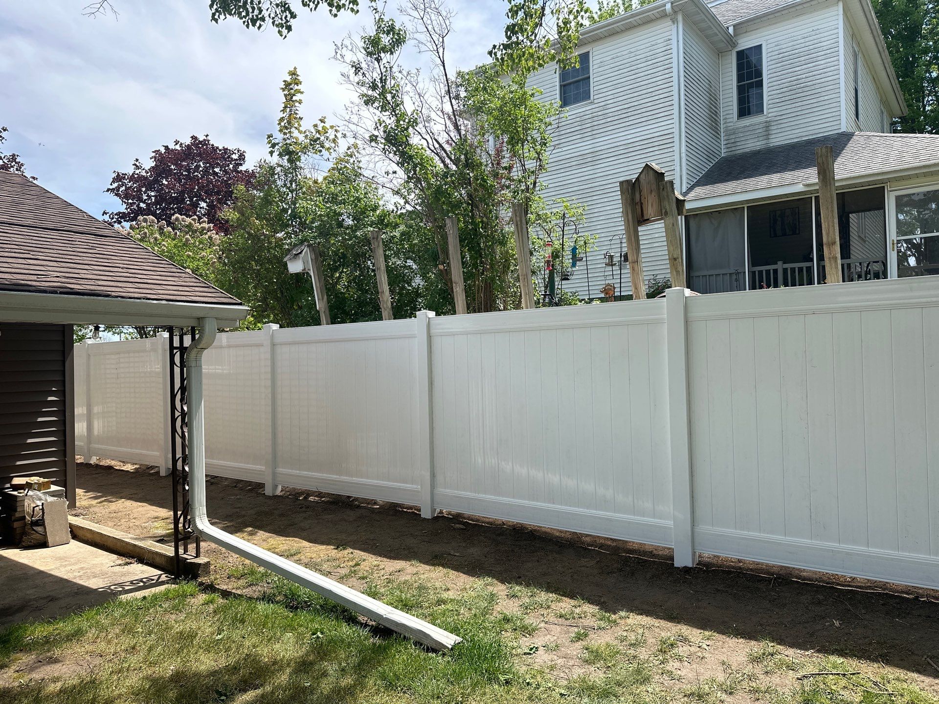 White Vinyl Privacy Fence Installation in Lawler, IA by Perfect Picket Fence and Stain