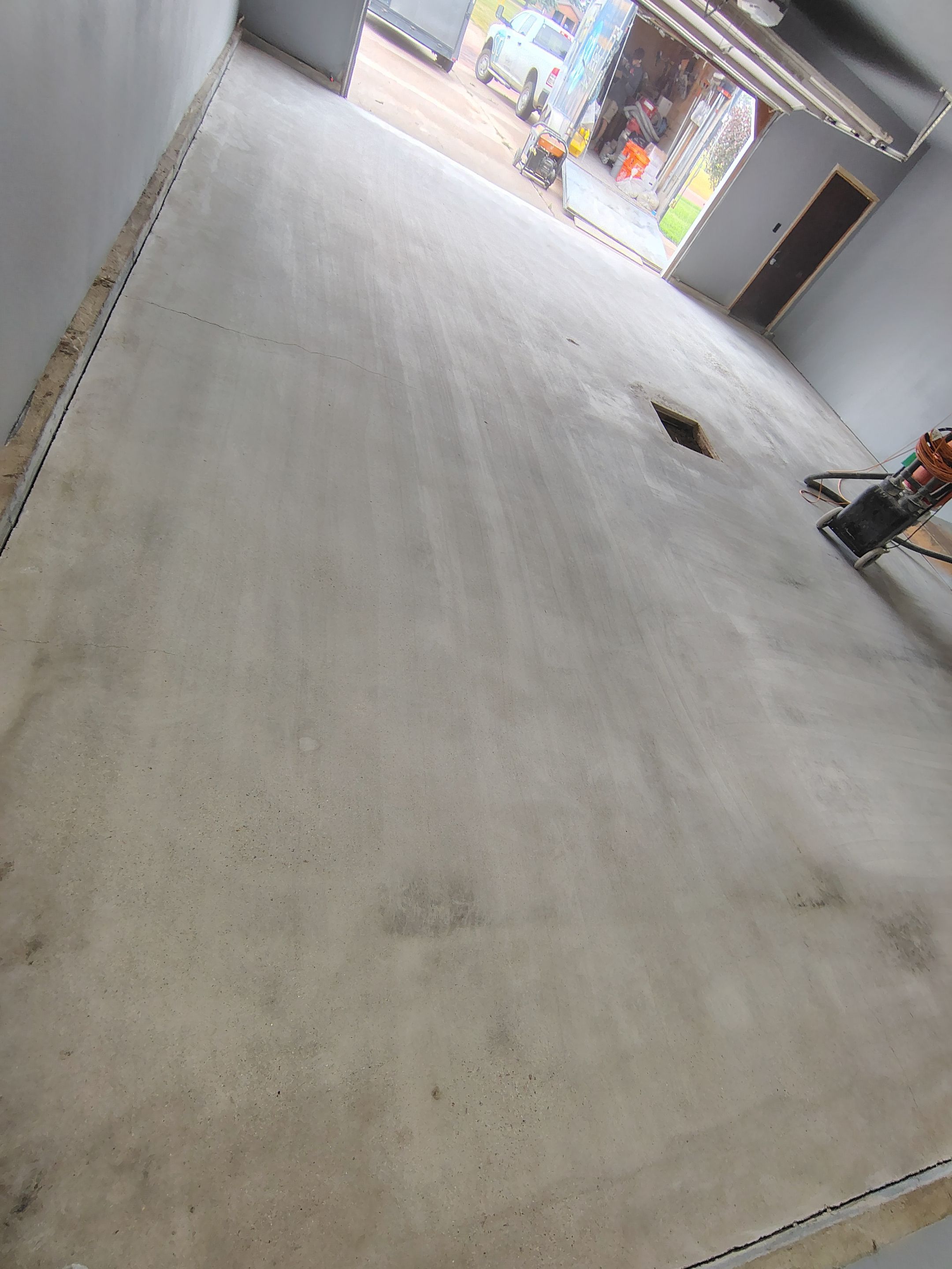Garage Floor Concrete Coating and Surface Restoration in Colman by Select Painting, Coatings & Garage Cabinets