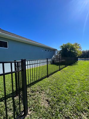Aluminum Fence Installation using Black 3 Rail Aluminum Fence