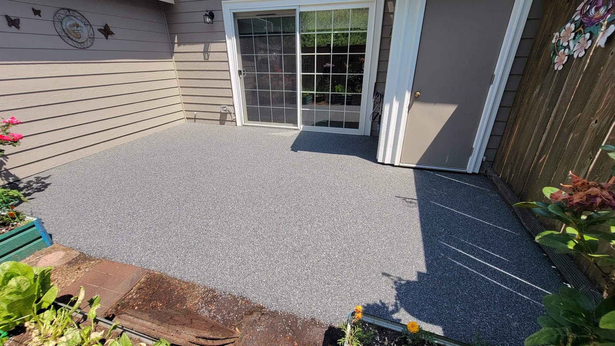 Urban Elegance Back Patio in Manhattan Vuba Stone by Concrete Coating Experts Inc.