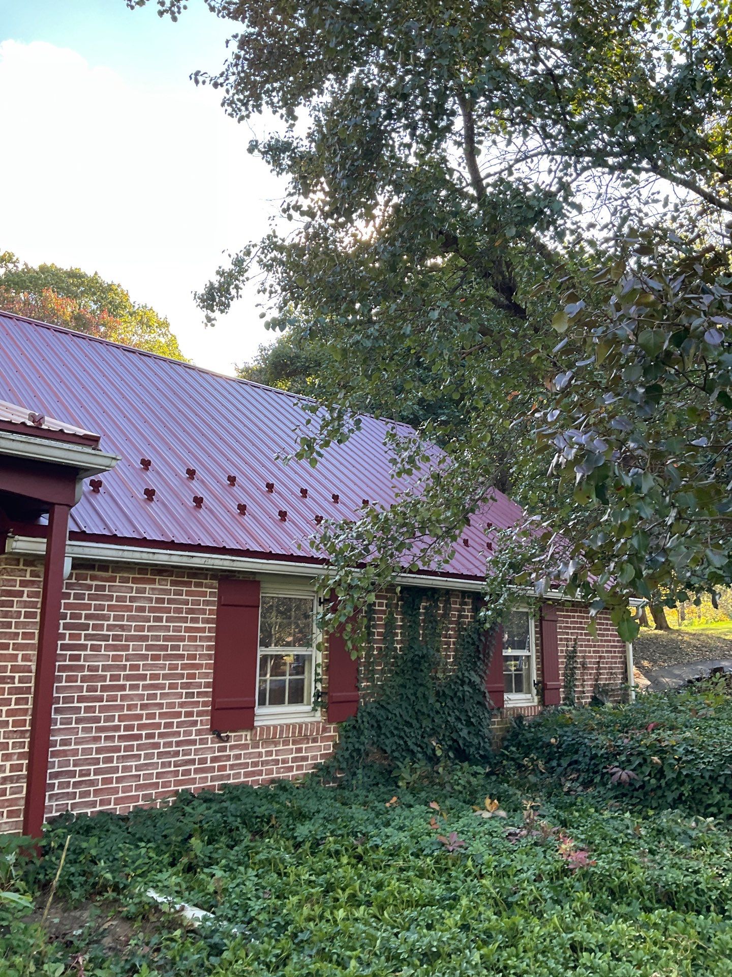 Red Metal Roofing Installation and Trim Restoration in Bernville by Esh Builders