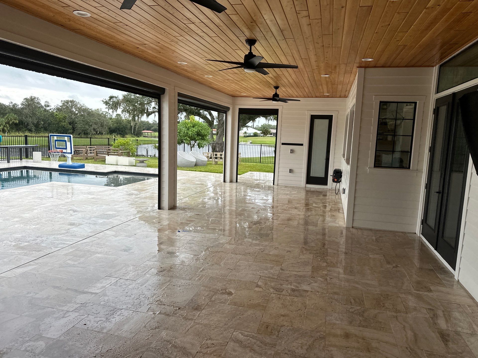 Complete Two-Story House Wash and Driveway Cleaning in Winding River Community, Bradenton, FL by Sunshine AquaWash