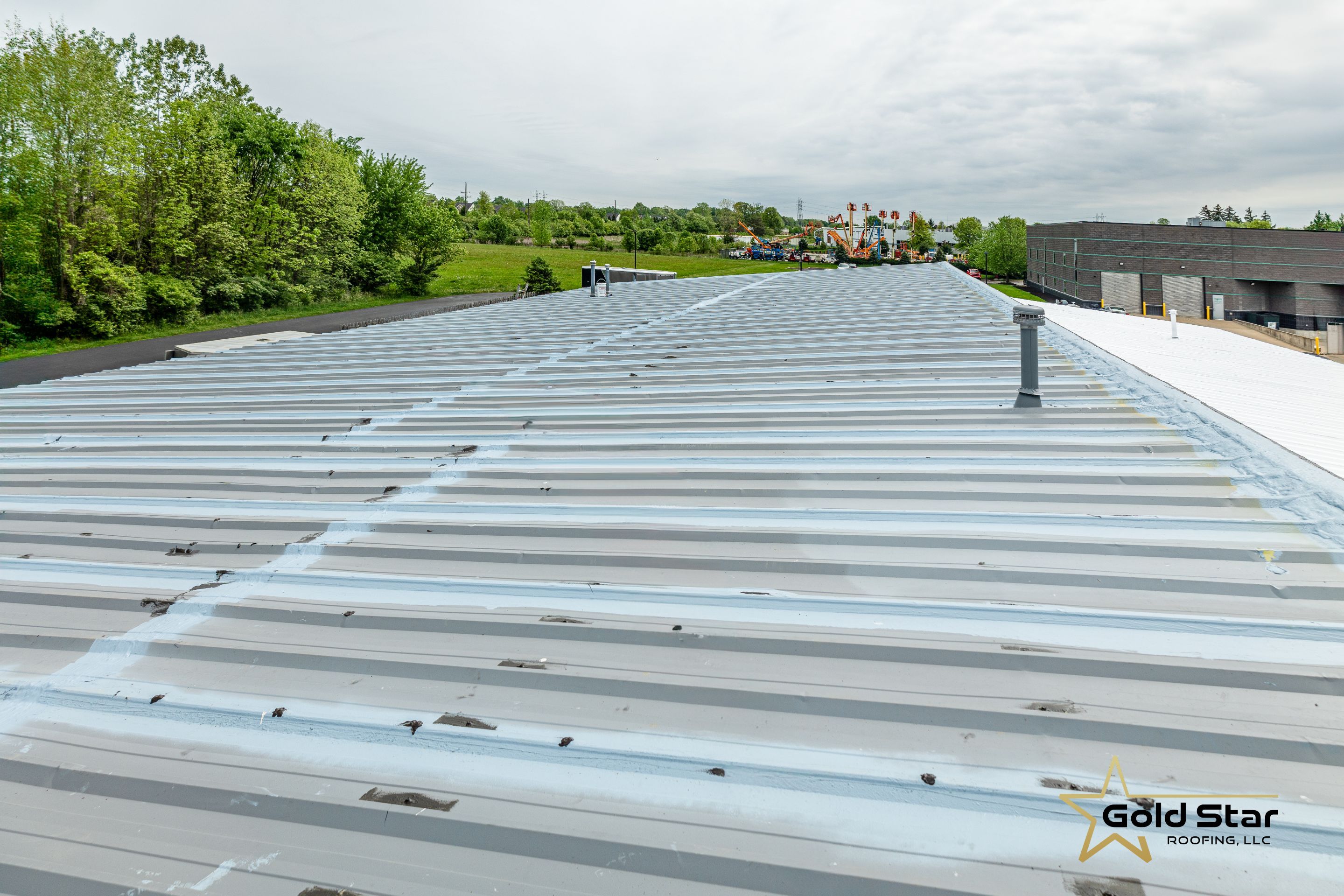 Berea Ohio Metal Roof Coating by Gold Star Roofing LLC 