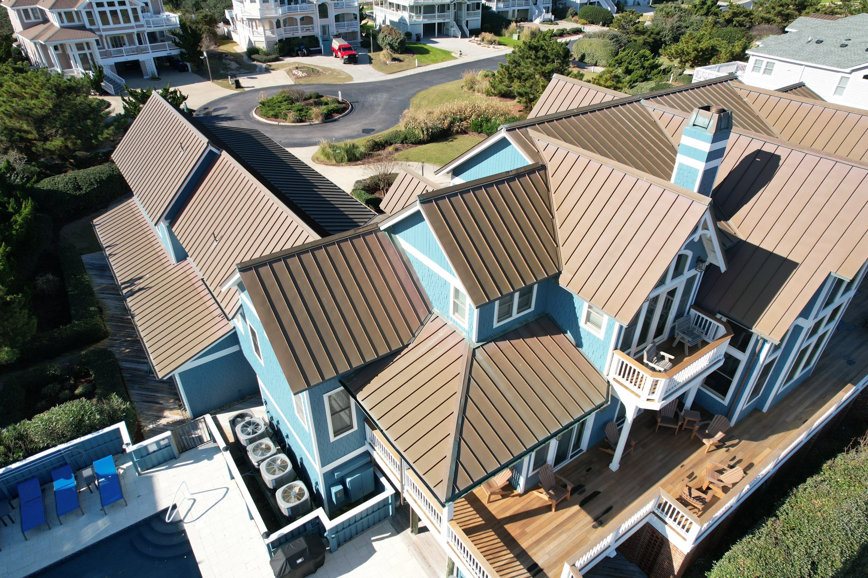 Large Metal Roof Transformation by Gallop Roofing & Remodeling, Inc.