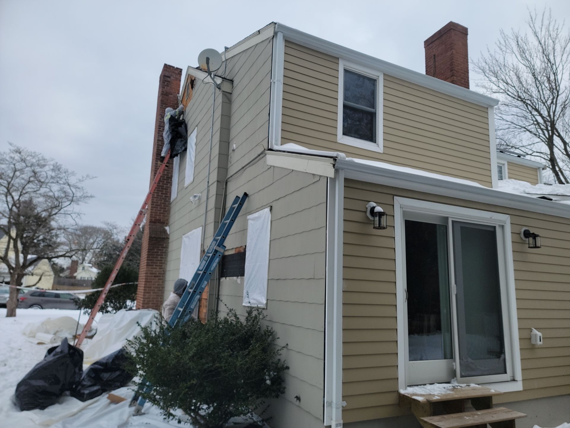 James Hardie siding, new metal roof and couple windows being installed. by UBrothers Construction