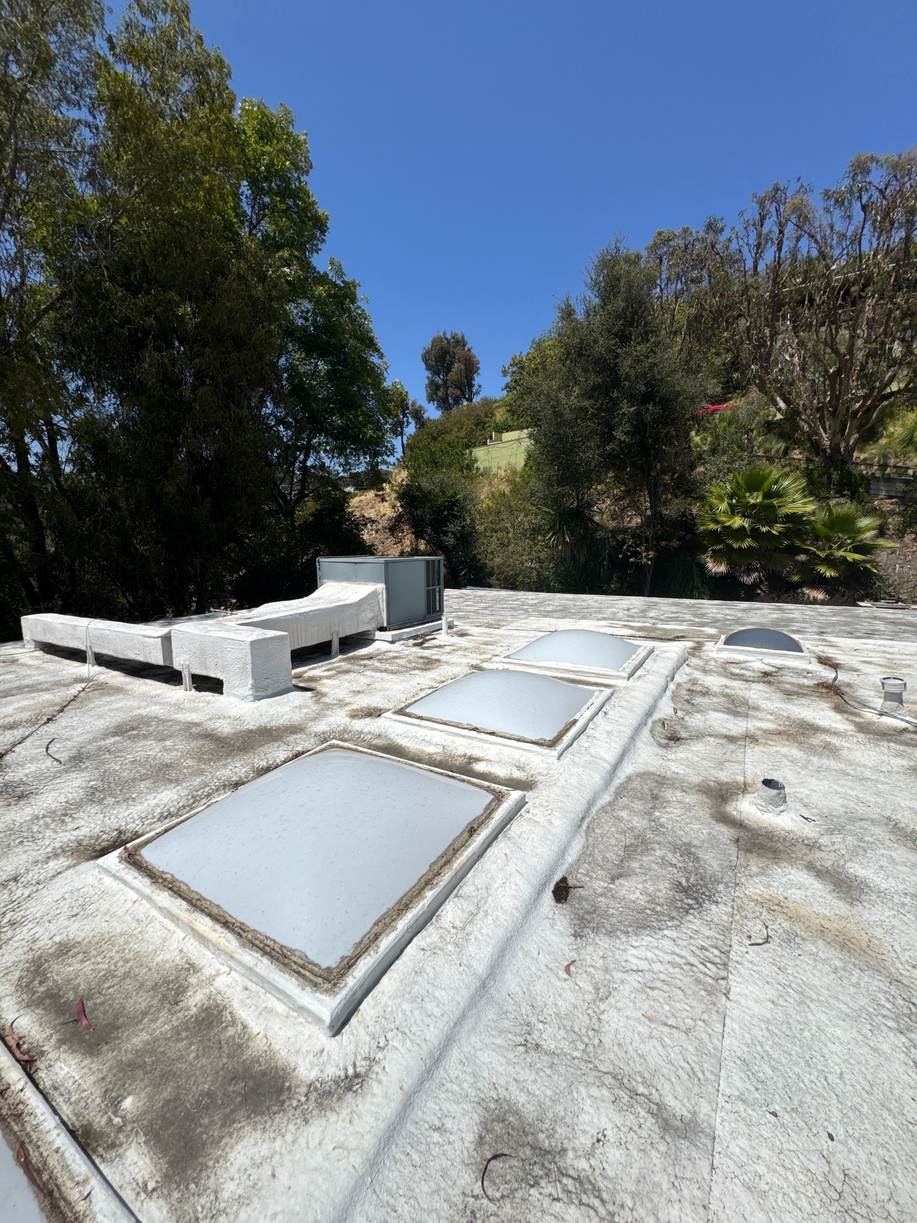 Residential Flat Roof Restoration with Silicone Coating in Brentwood by Hull Brothers Roofing