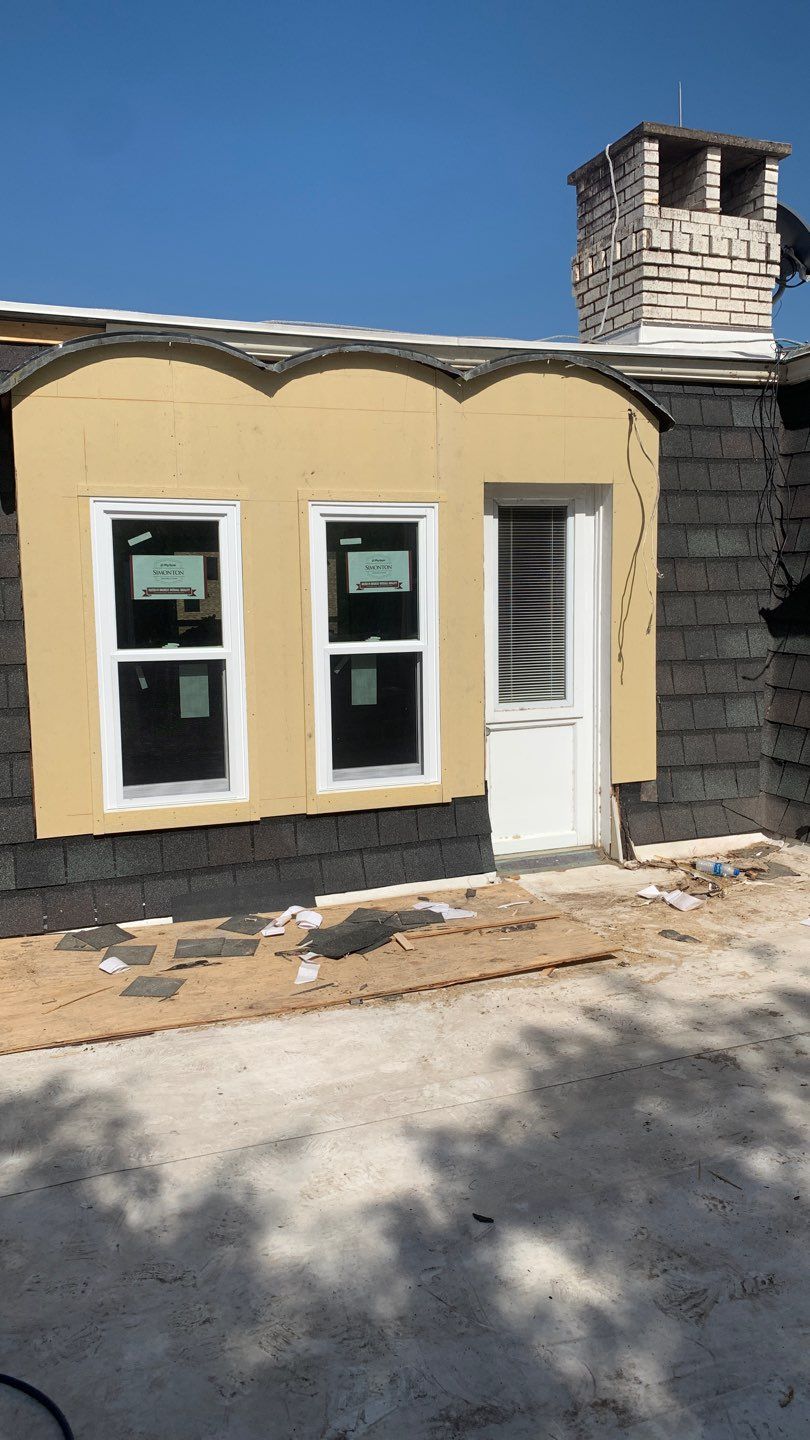 Mansard Charm by Bayfront Roofing and Construction