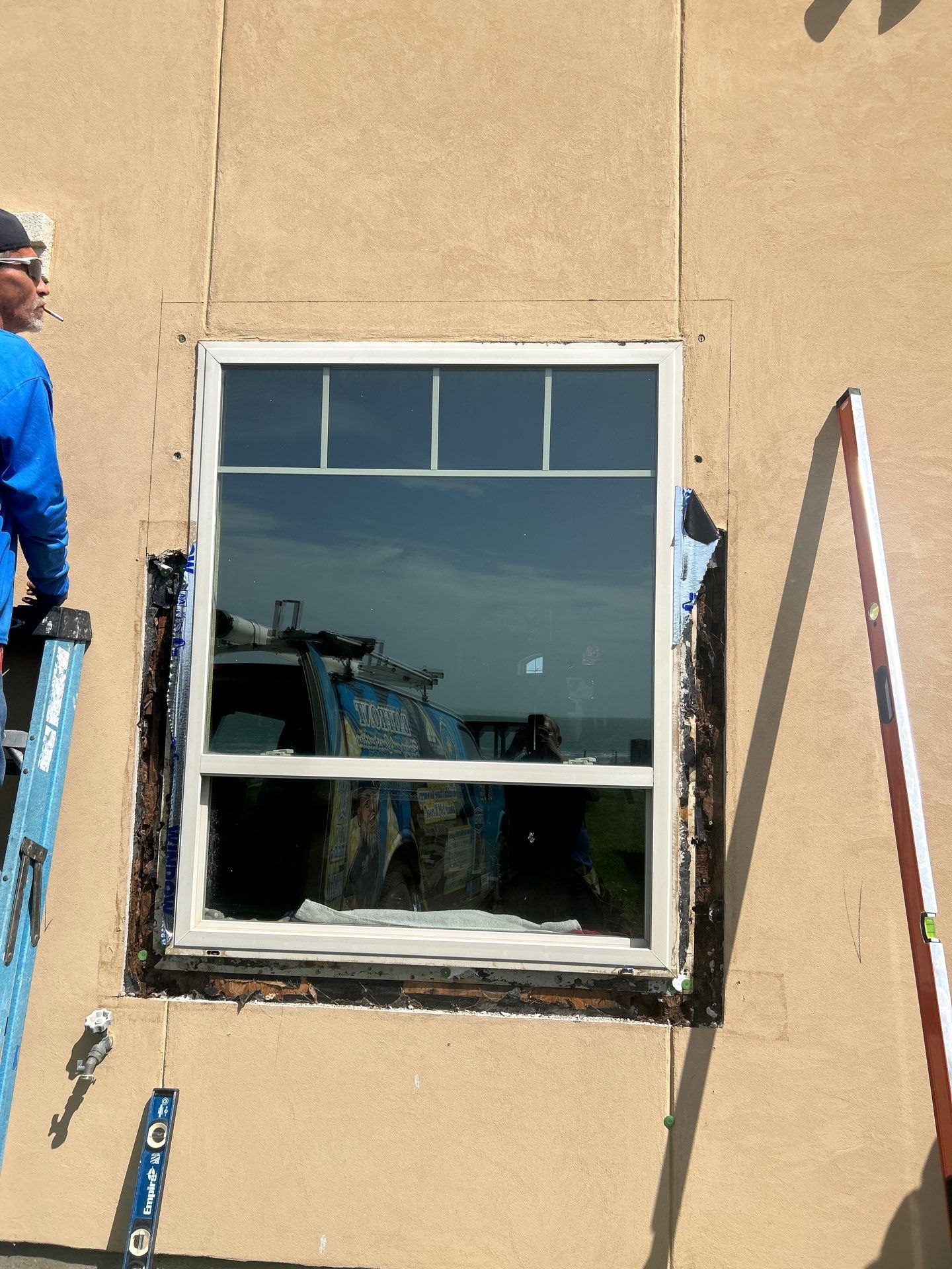 Installing Windows on a Submarine  by Bayfront Roofing and Construction