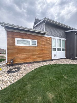 Modern Exterior Transformation Featuring Dark Board and Batten Siding in Sioux Falls