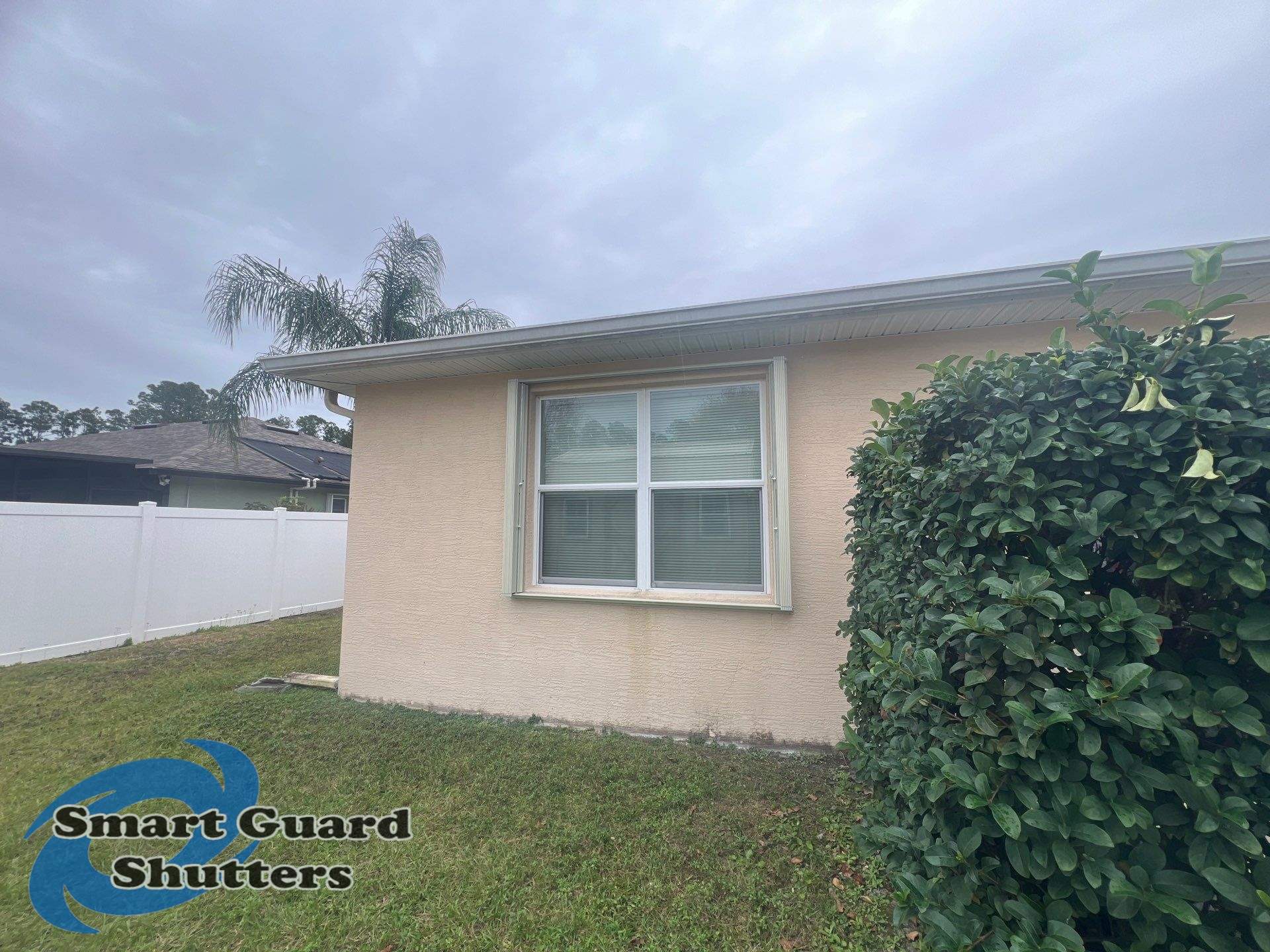 Accordion Shutters in Ivory by Smart Guard Shutters