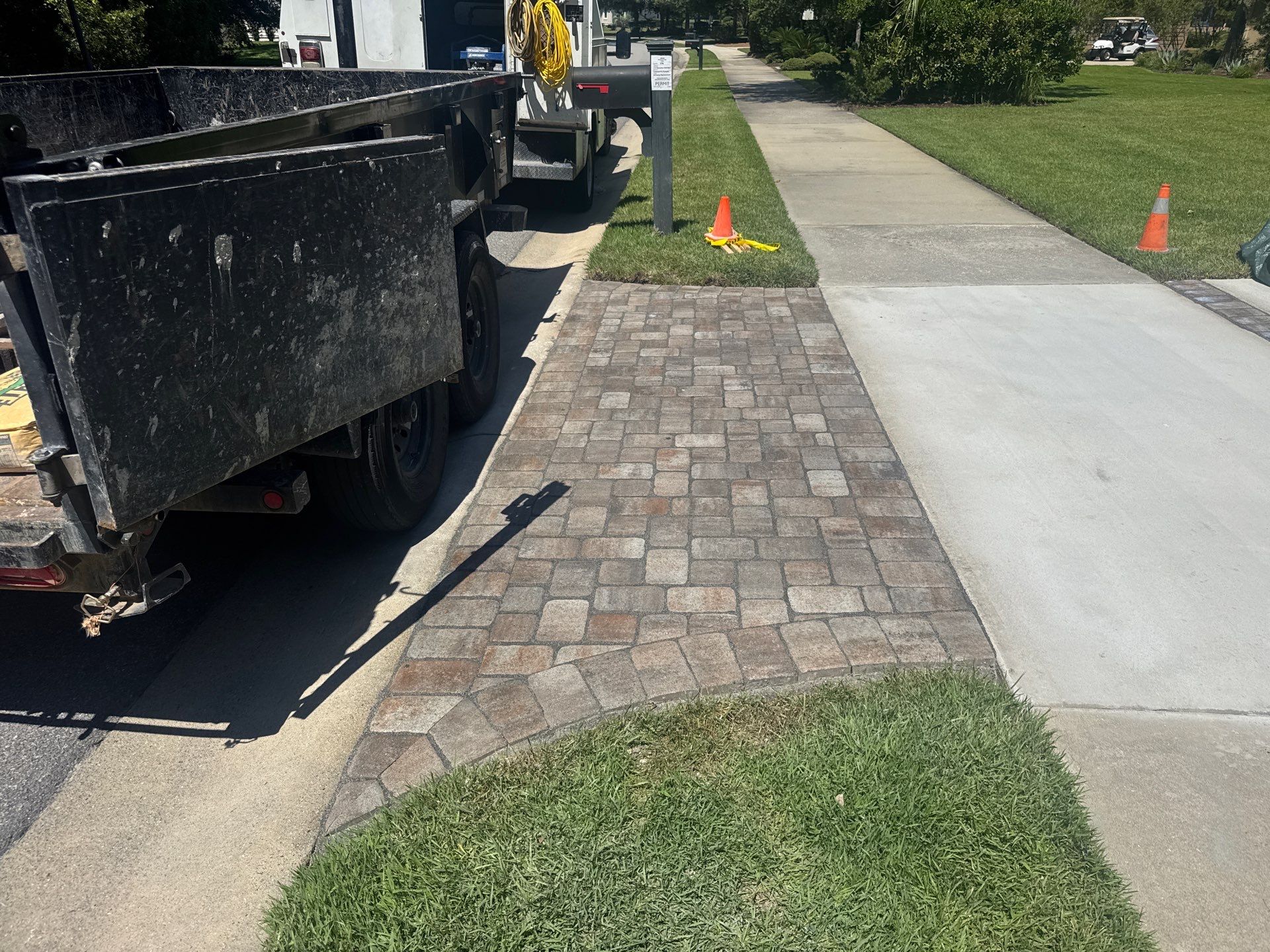 Custom Concrete Driveway and Decorative Paver Installation in Bluffton by Lowcountry Scapes, LLC