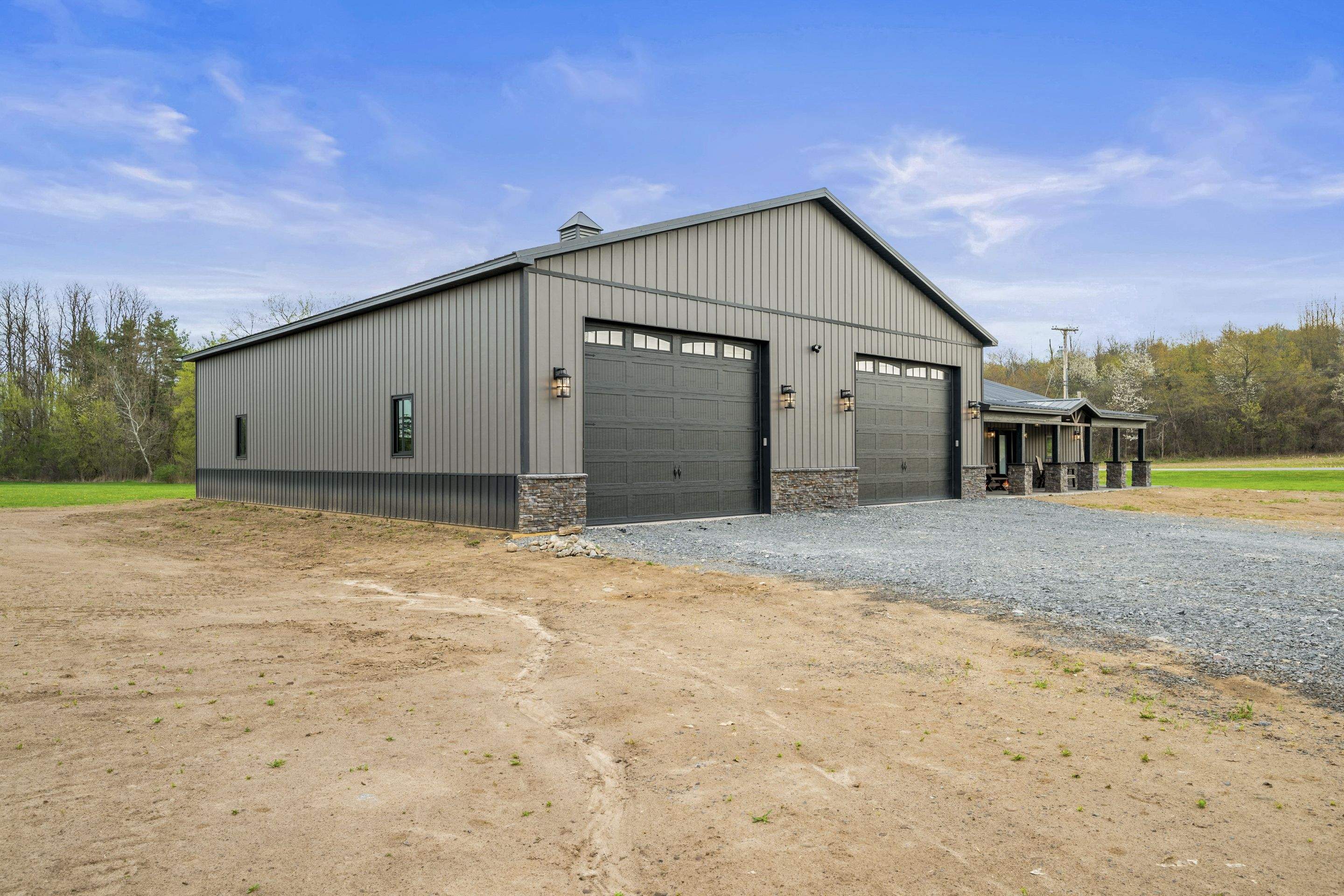 Barndominium  using Textured Board & Batton by Horst Custom Homes 