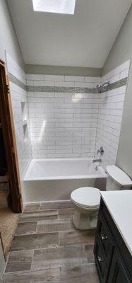 Beautiful tile tub surround and tile floors! Customer started, TSC finished