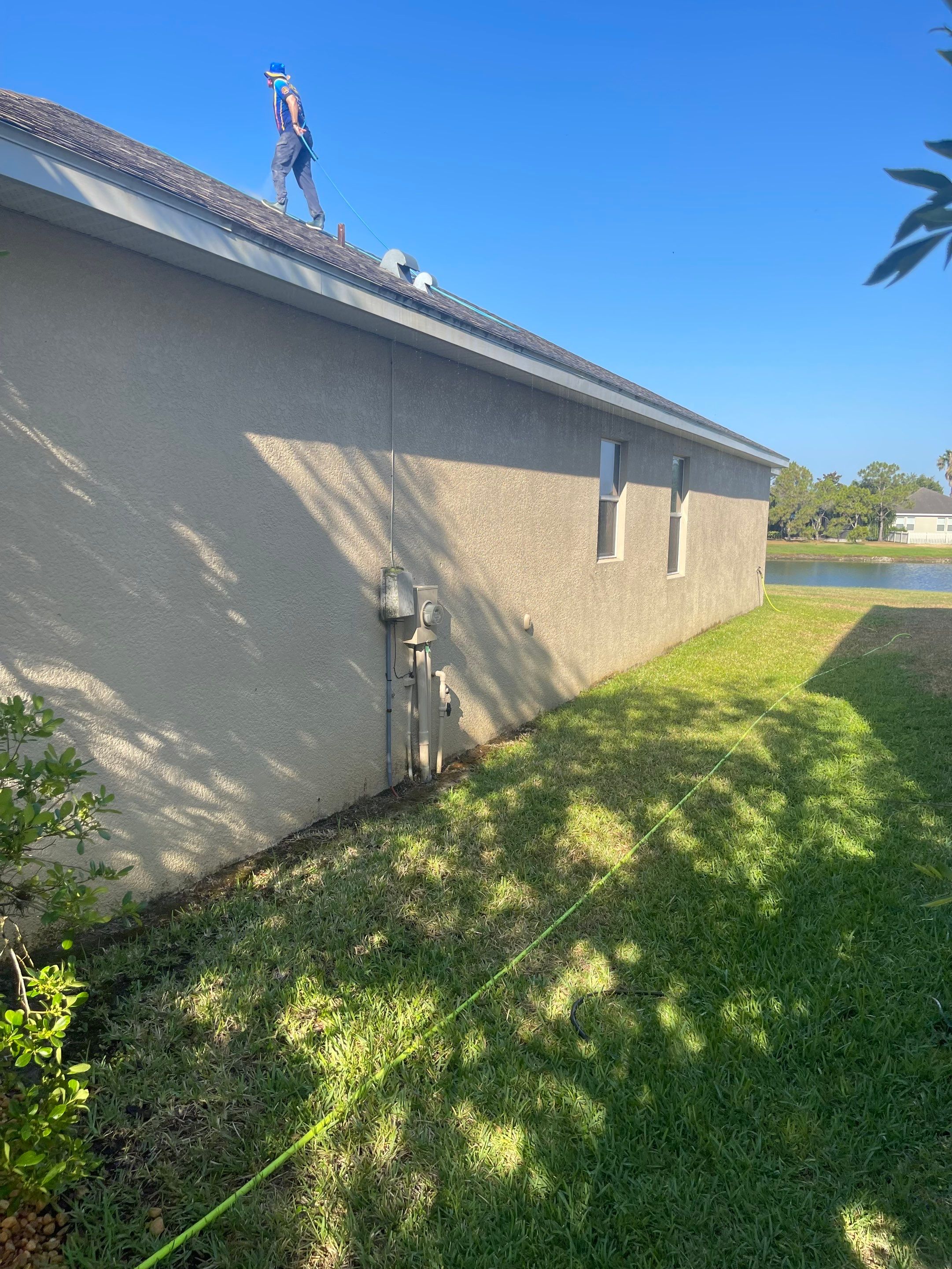 Asphalt Shingle Roof Soft Wash Cleaning & Concrete Pressure Washing in CopperStone Community, Parrish, FL by Sunshine AquaWash