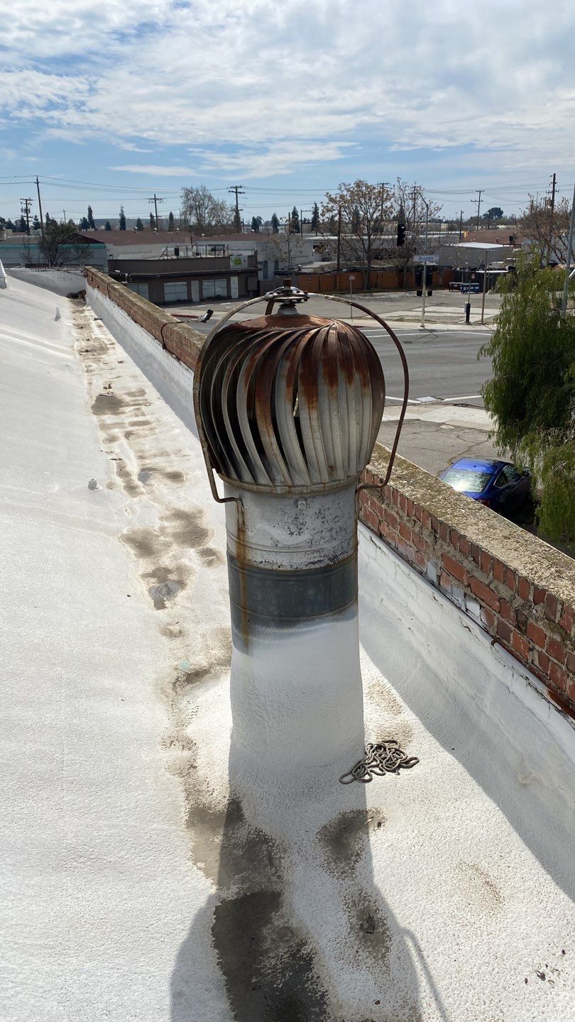 Polyurethane foam roof refurbish and recoating by Straight Edge Roofing Inc