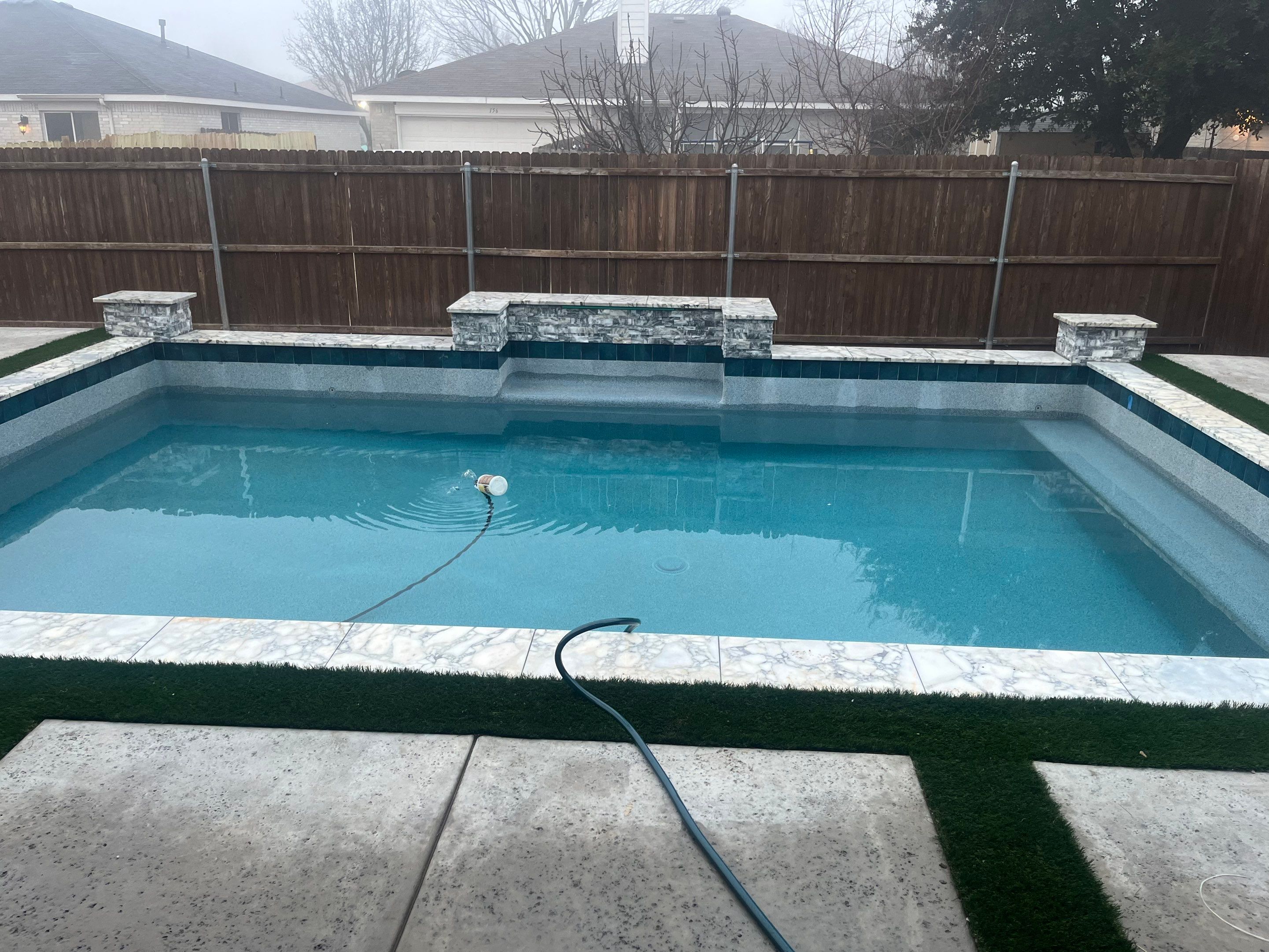 Geometric Pool with Raised Water Feature Wall and Turf by Pinnacle Pools and Spas - DFW
