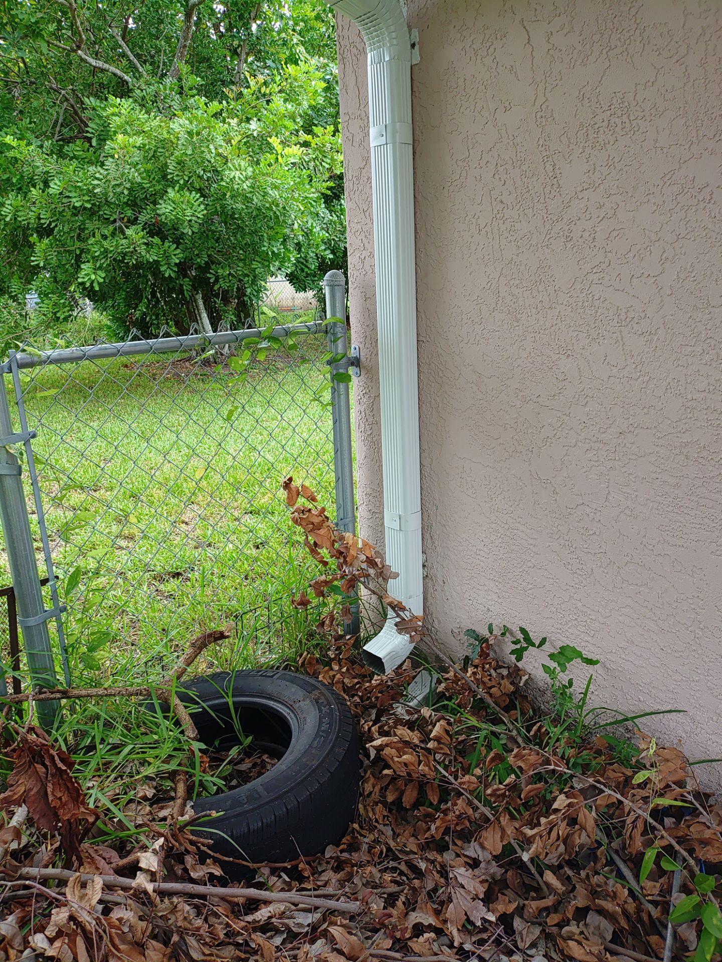 Replace gutter using White Down Spouts in Cape Coral FL by Gutter Professors