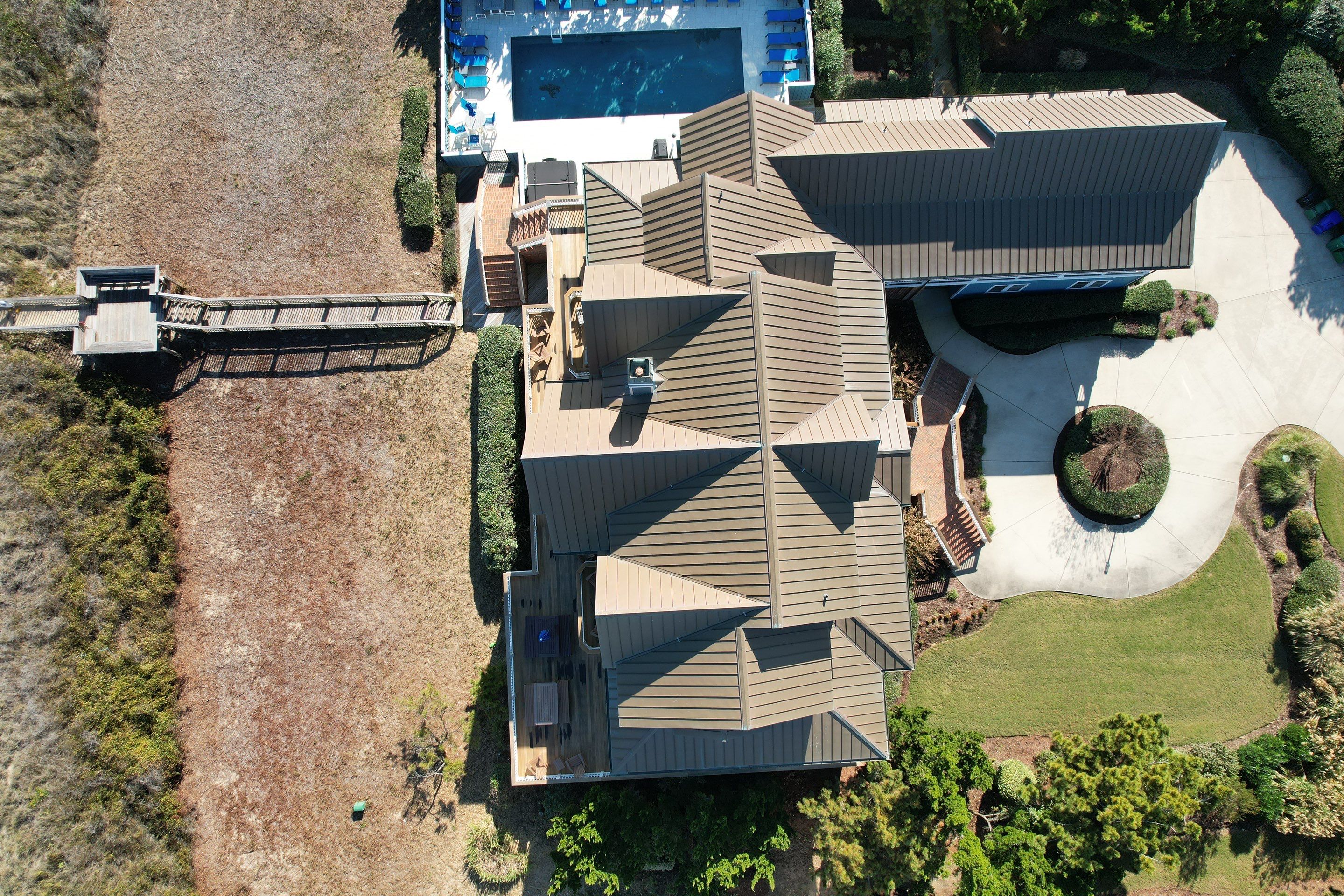 Large Metal Roof Transformation by Gallop Roofing & Remodeling, Inc.