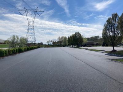 Asphalt Resurface Commercial Park Lot using asphalt