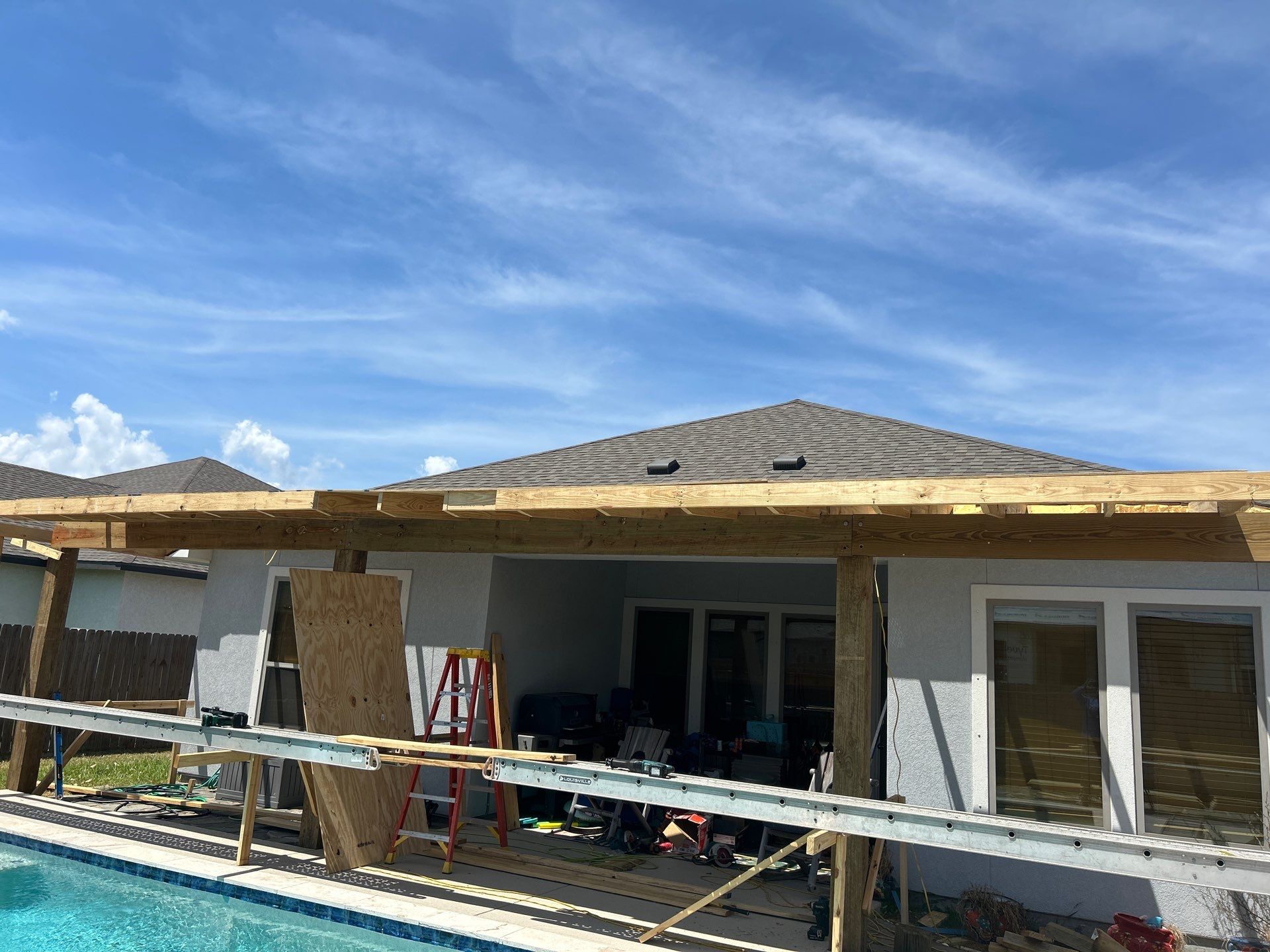 Patio Pool Cover by Bayfront Roofing and Construction