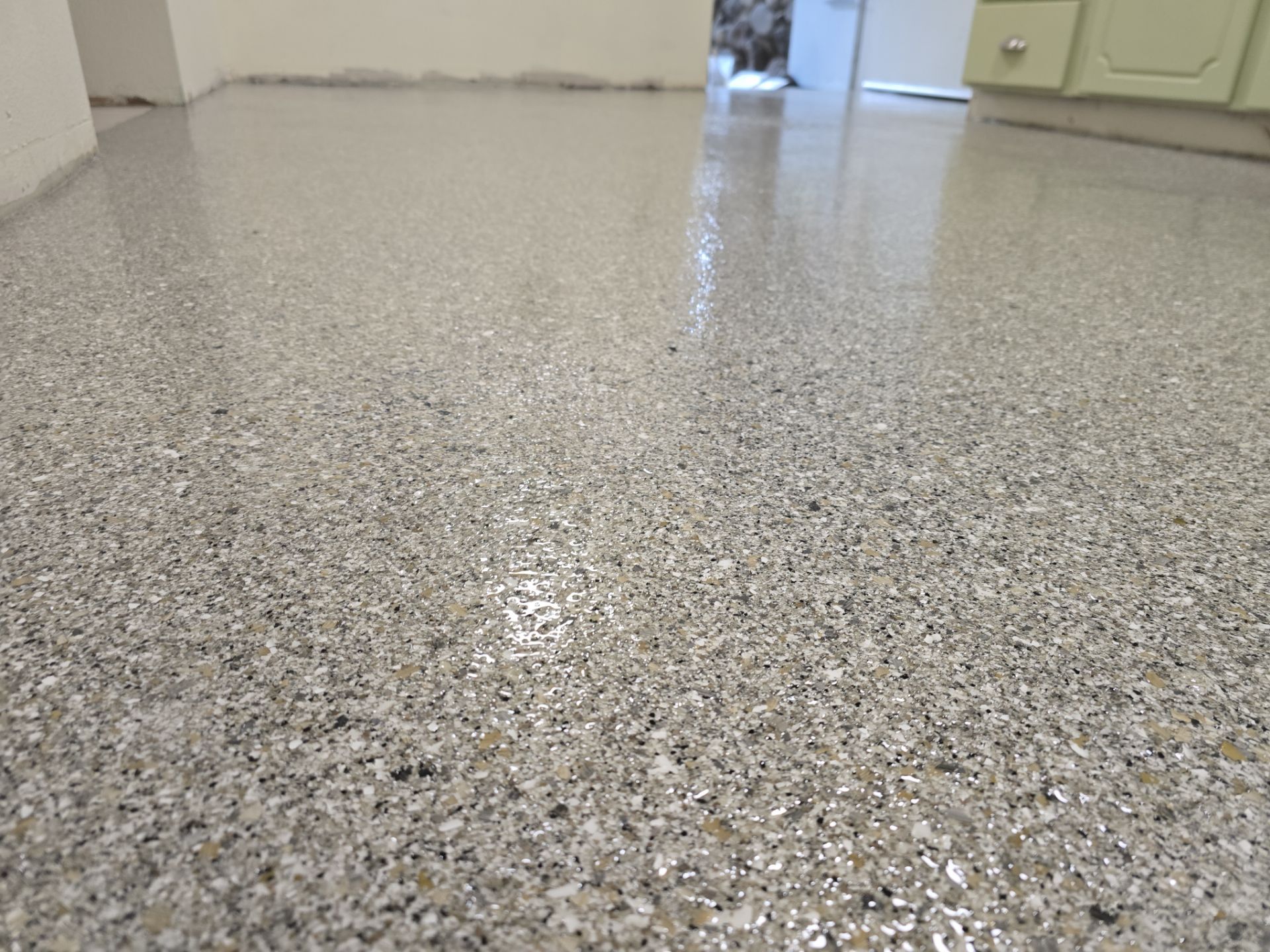 Quartzite Hybrid Flooring Transformation for a Kennewick Utility Room by Croc Coatings, LLC