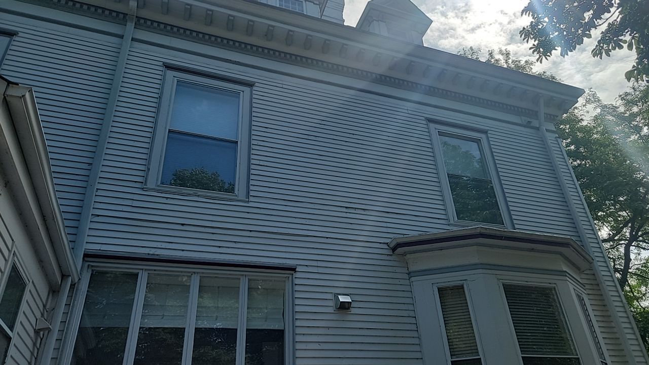 Housewashing  using Algaecide, soft wash soap by Northern Power Washing LLC.