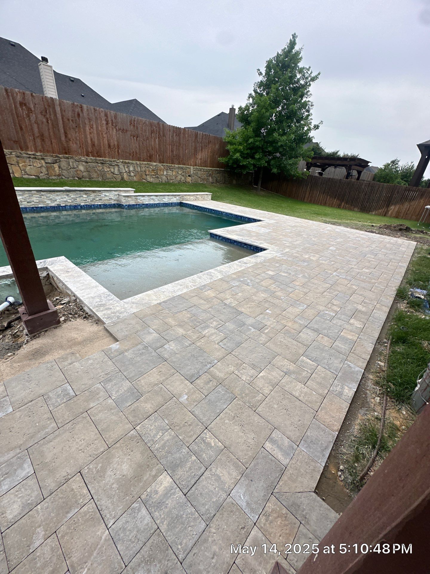 Modern Geometric Pool with Raised Stone Wall and Paver Deck by Pinnacle Pools and Spas - DFW
