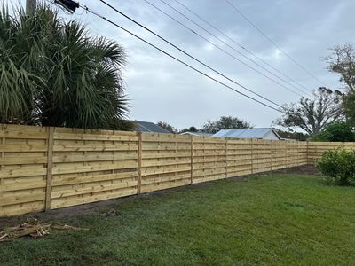 Wood Fence Installation using 6Ft Tall Pressure Treated Wood Privacy Fence