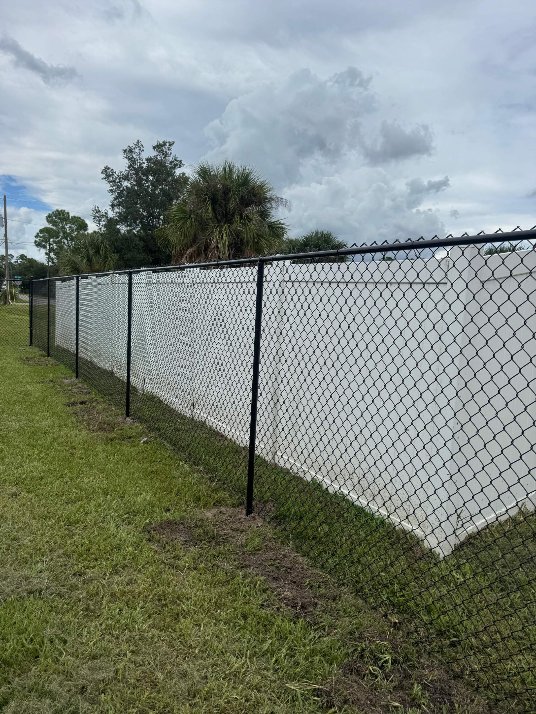 Residential Black Chain Link Fence Installation in North Port by True Fence LLC